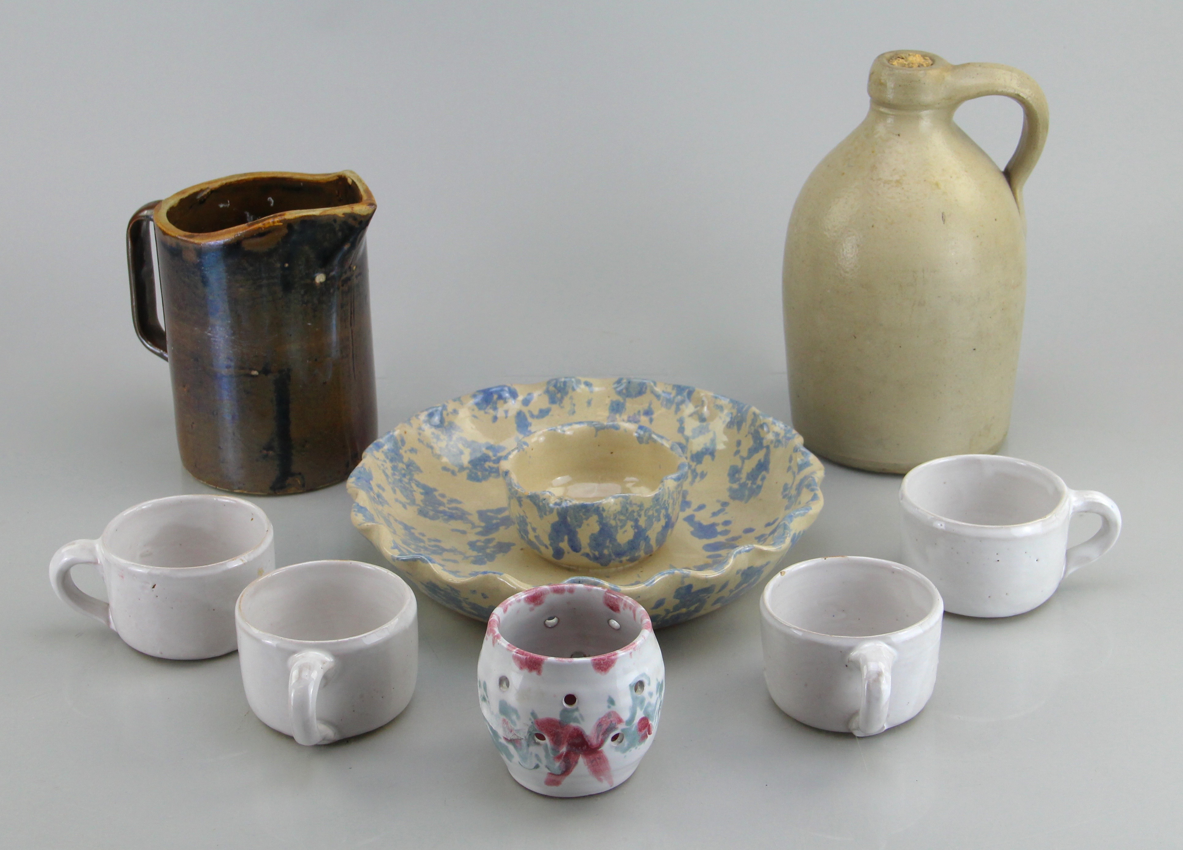 Assorted Ceramic Ware Including Cups, Pitcher, Tray, And Jug