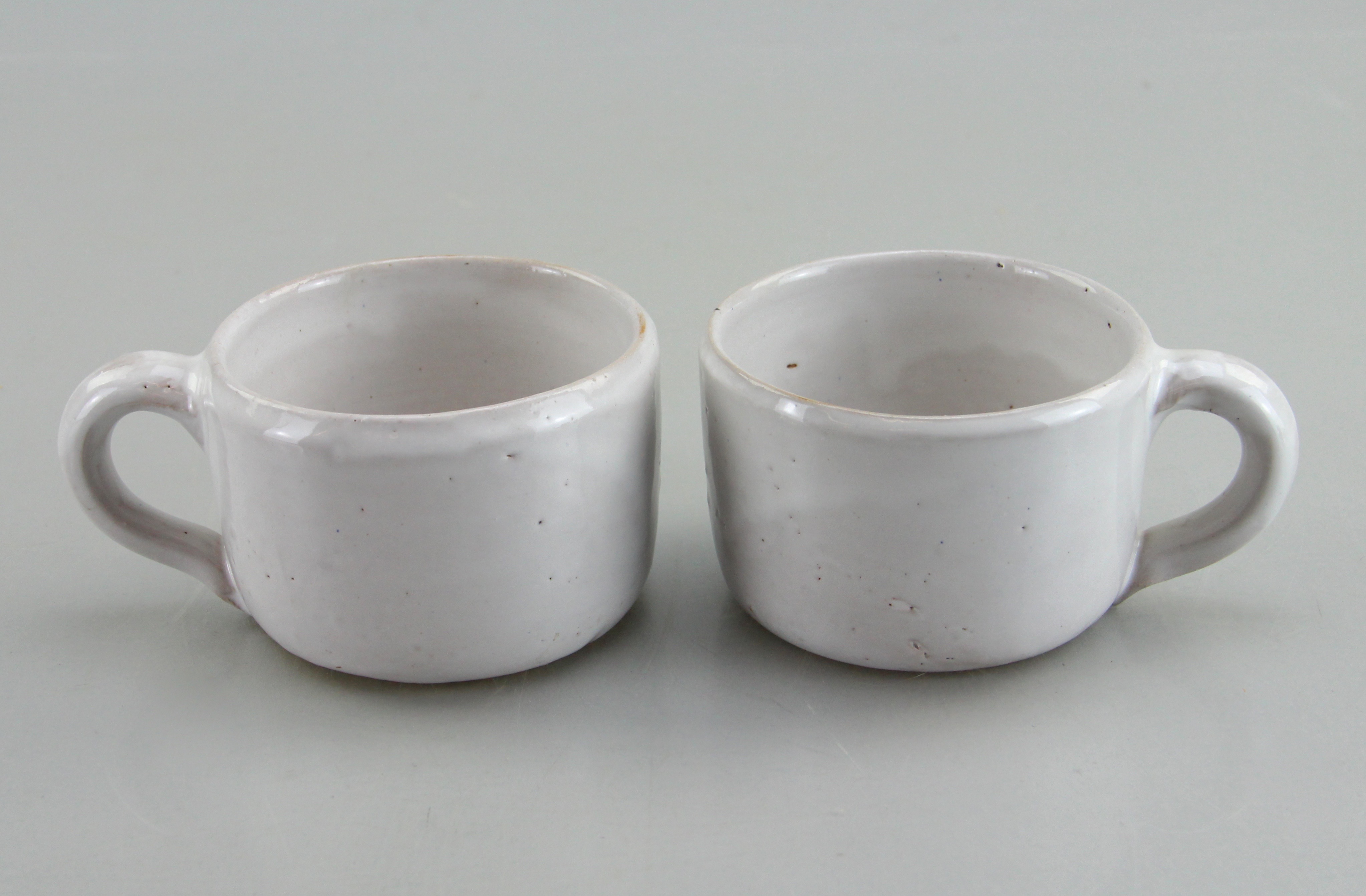 Assorted Ceramic Ware Including Cups, Pitcher, Tray, And Jug