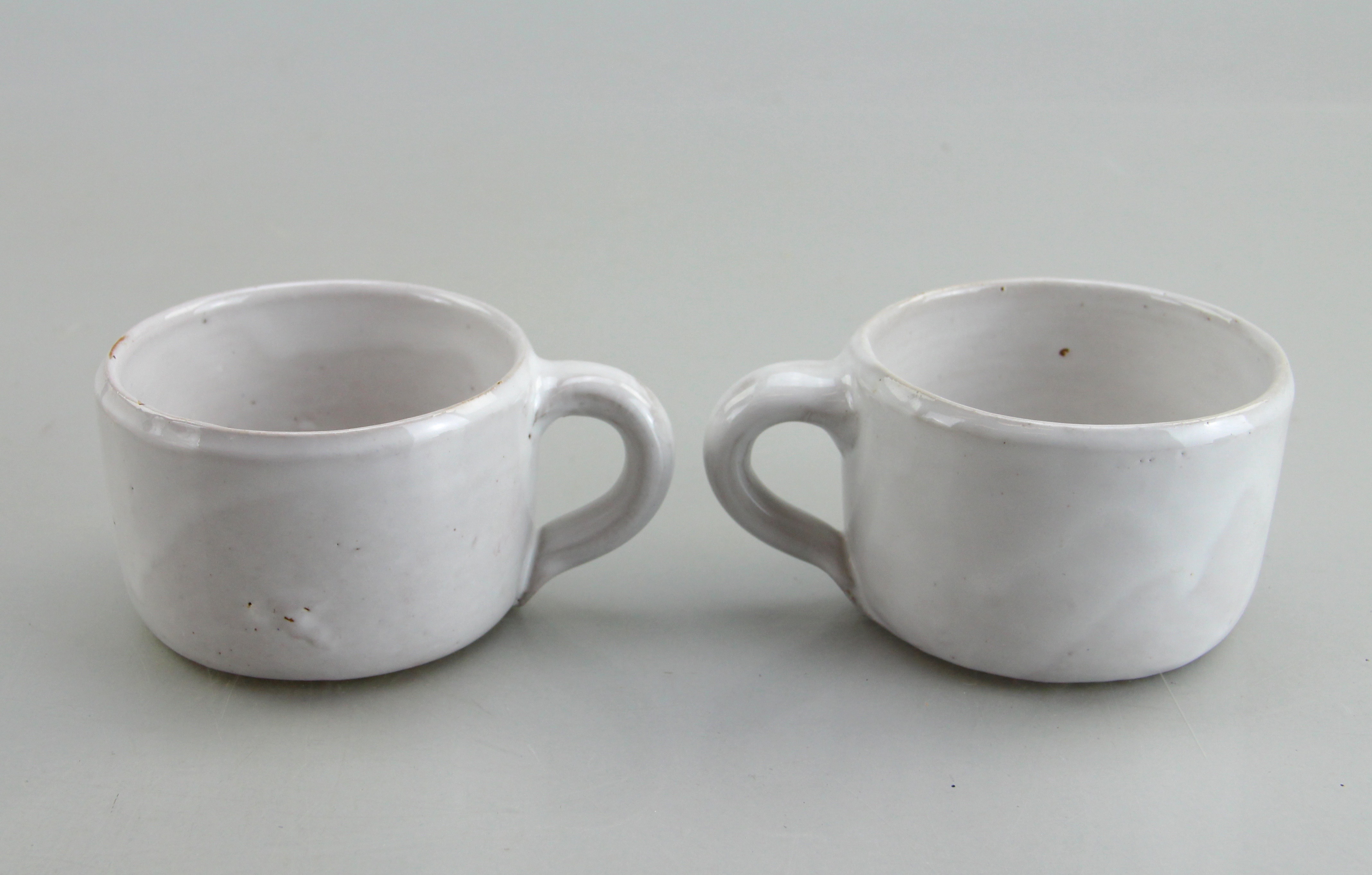 Assorted Ceramic Ware Including Cups, Pitcher, Tray, And Jug