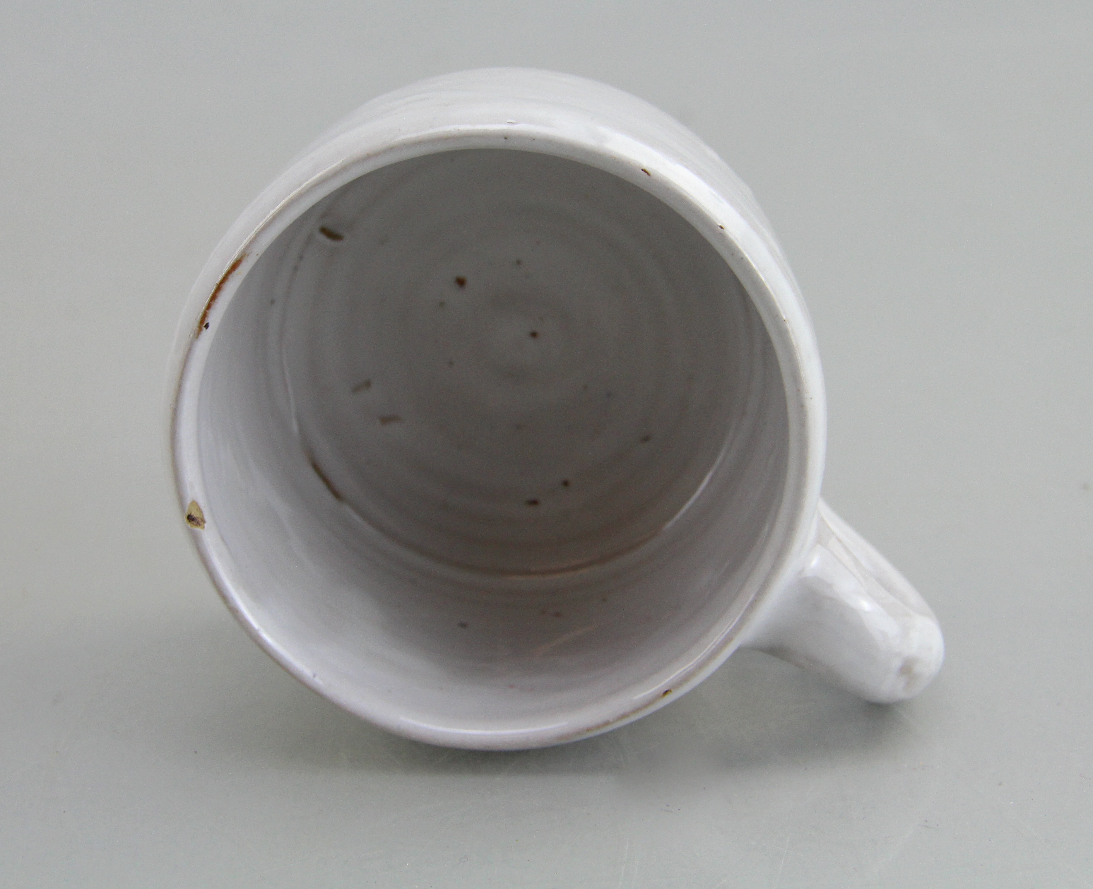 Assorted Ceramic Ware Including Cups, Pitcher, Tray, And Jug