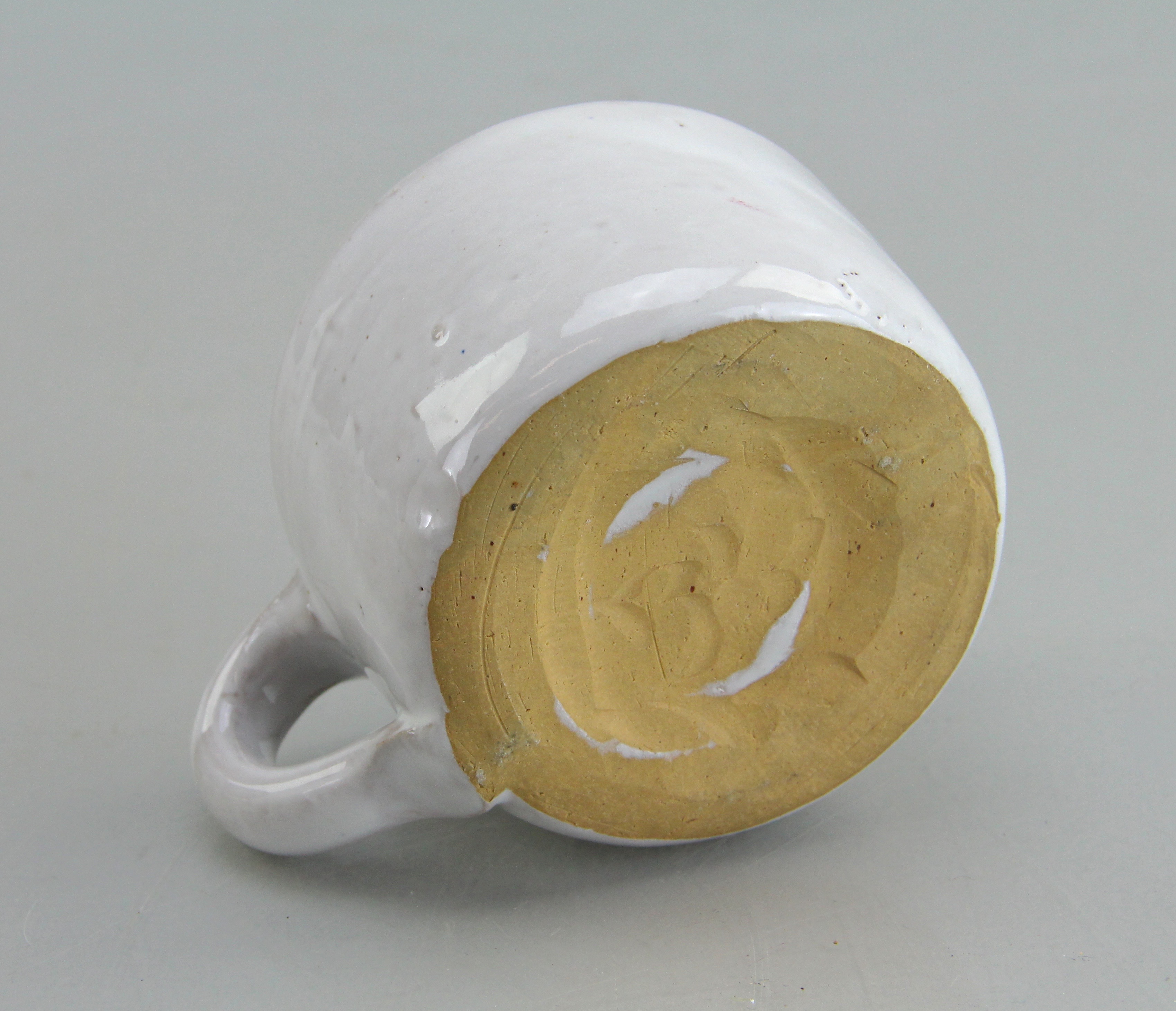 Assorted Ceramic Ware Including Cups, Pitcher, Tray, And Jug