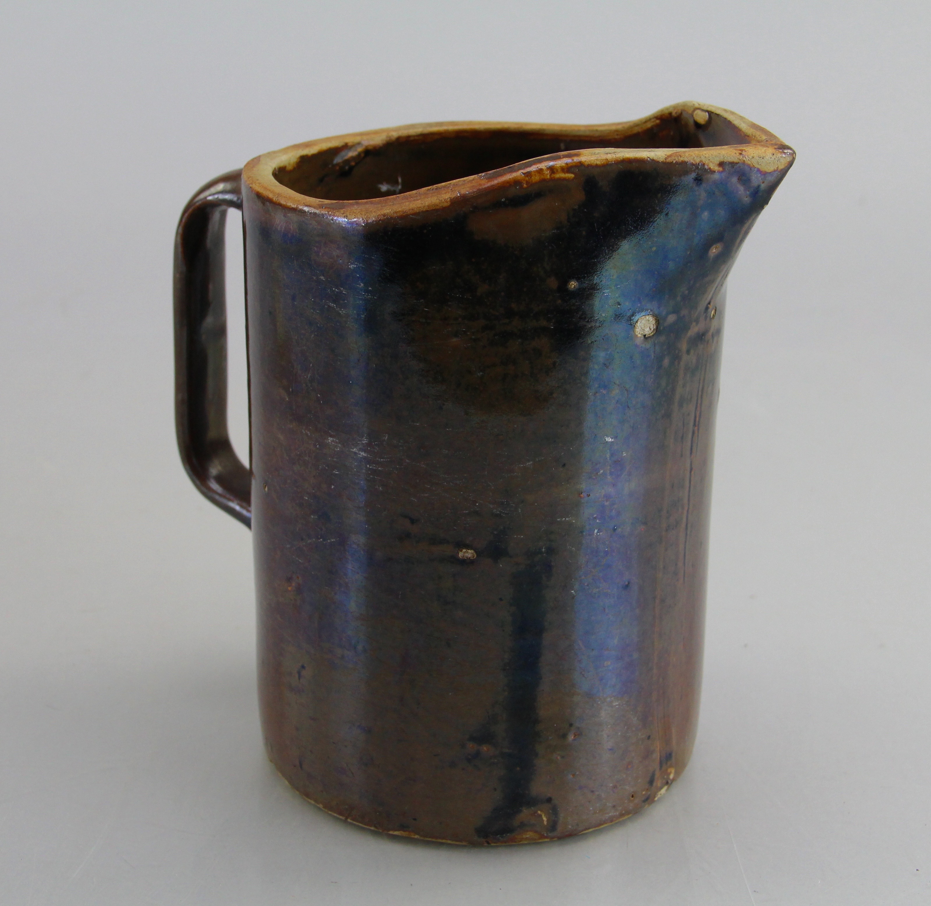 Assorted Ceramic Ware Including Cups, Pitcher, Tray, And Jug