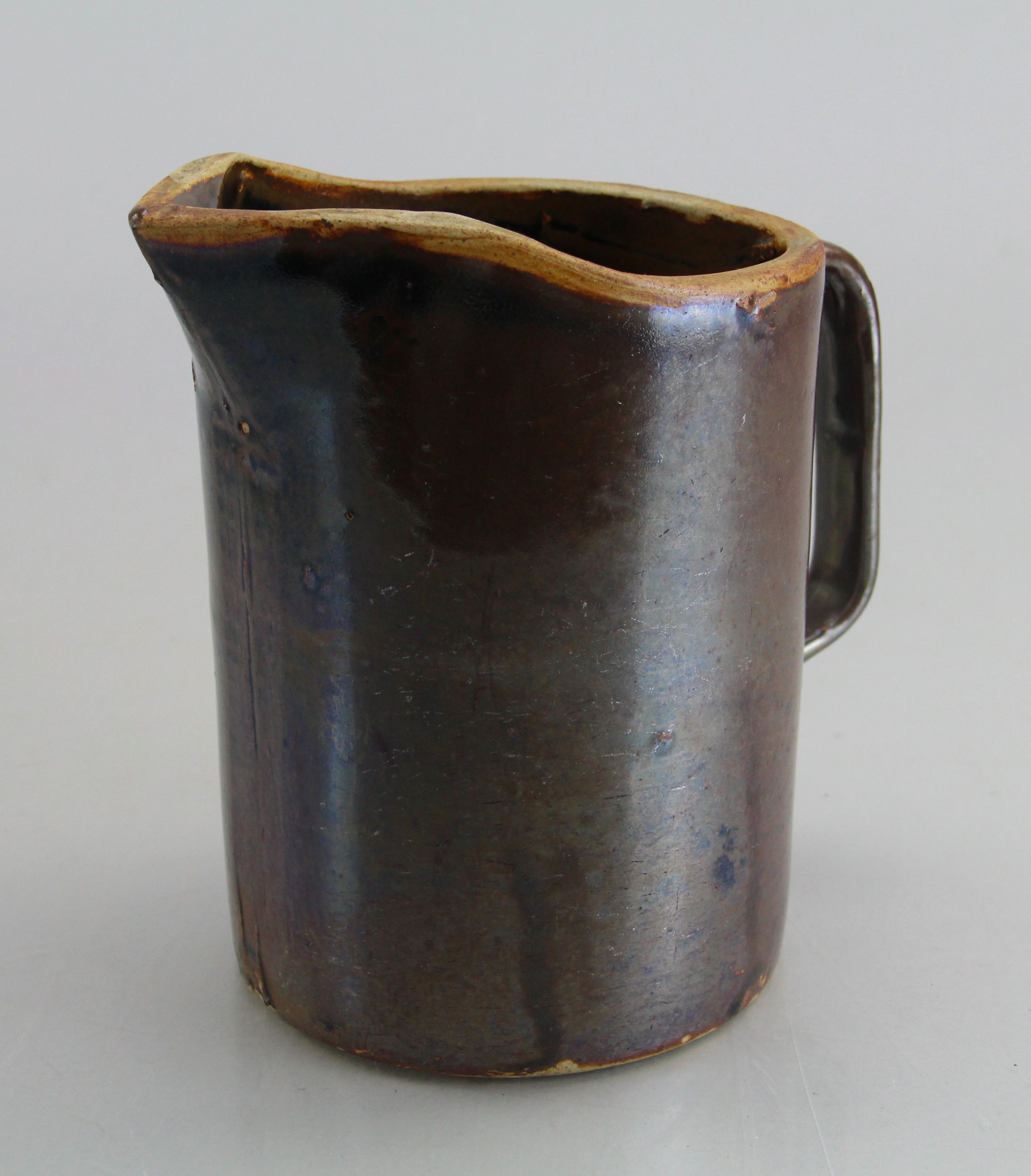 Assorted Ceramic Ware Including Cups, Pitcher, Tray, And Jug