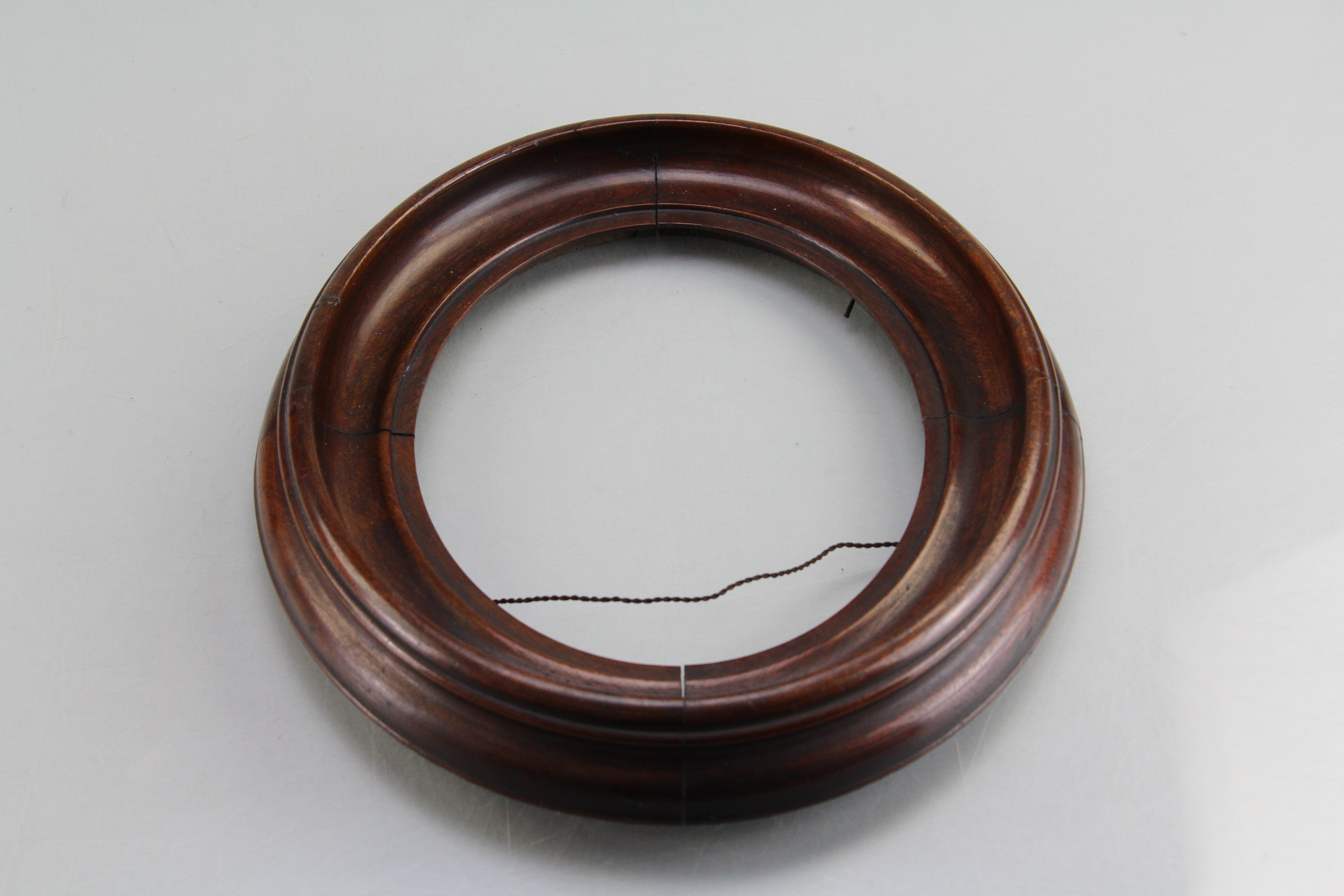 Assortment of Oval Wooden Framed Portrait Photos and Empty Frames