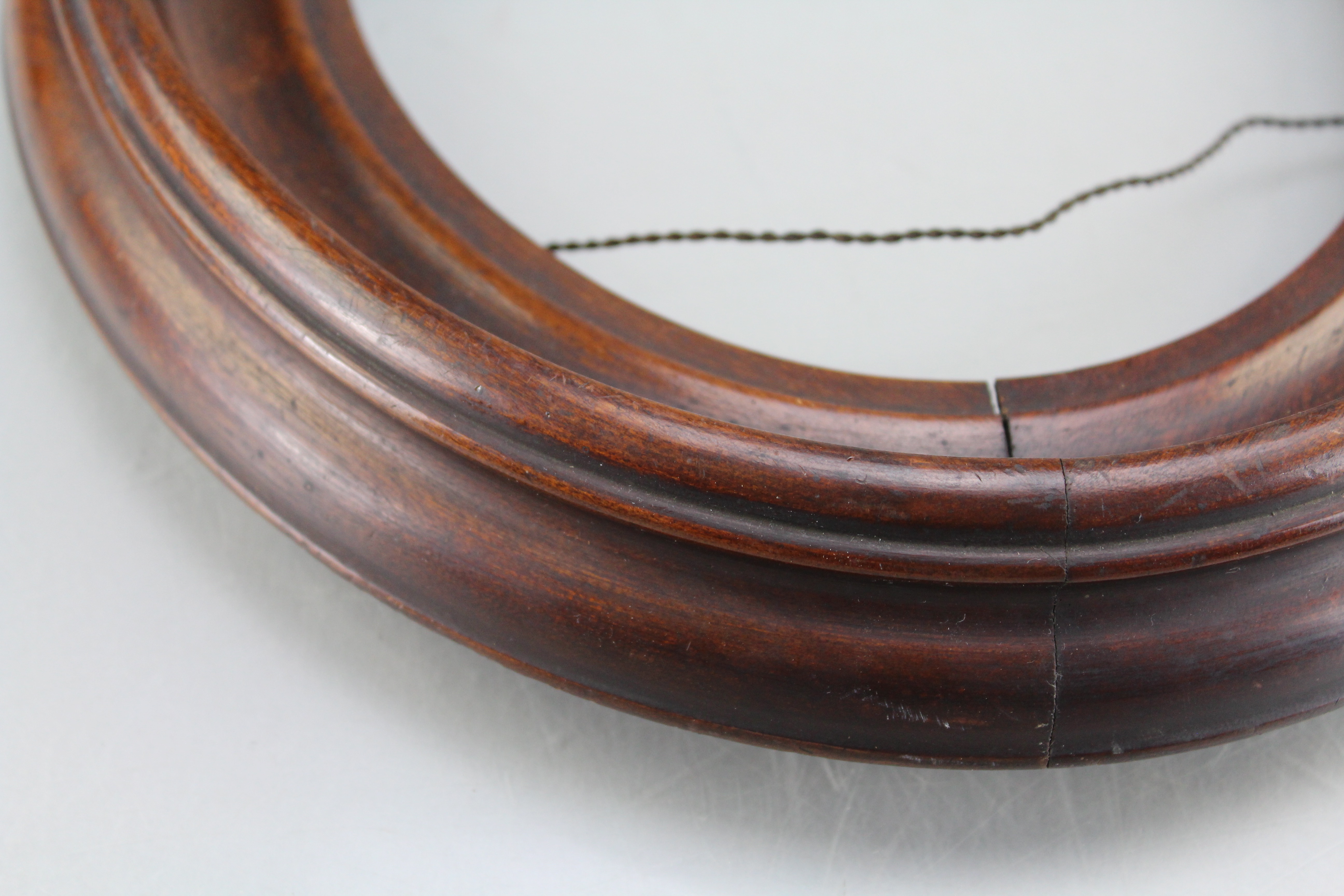 Assortment of Oval Wooden Framed Portrait Photos and Empty Frames