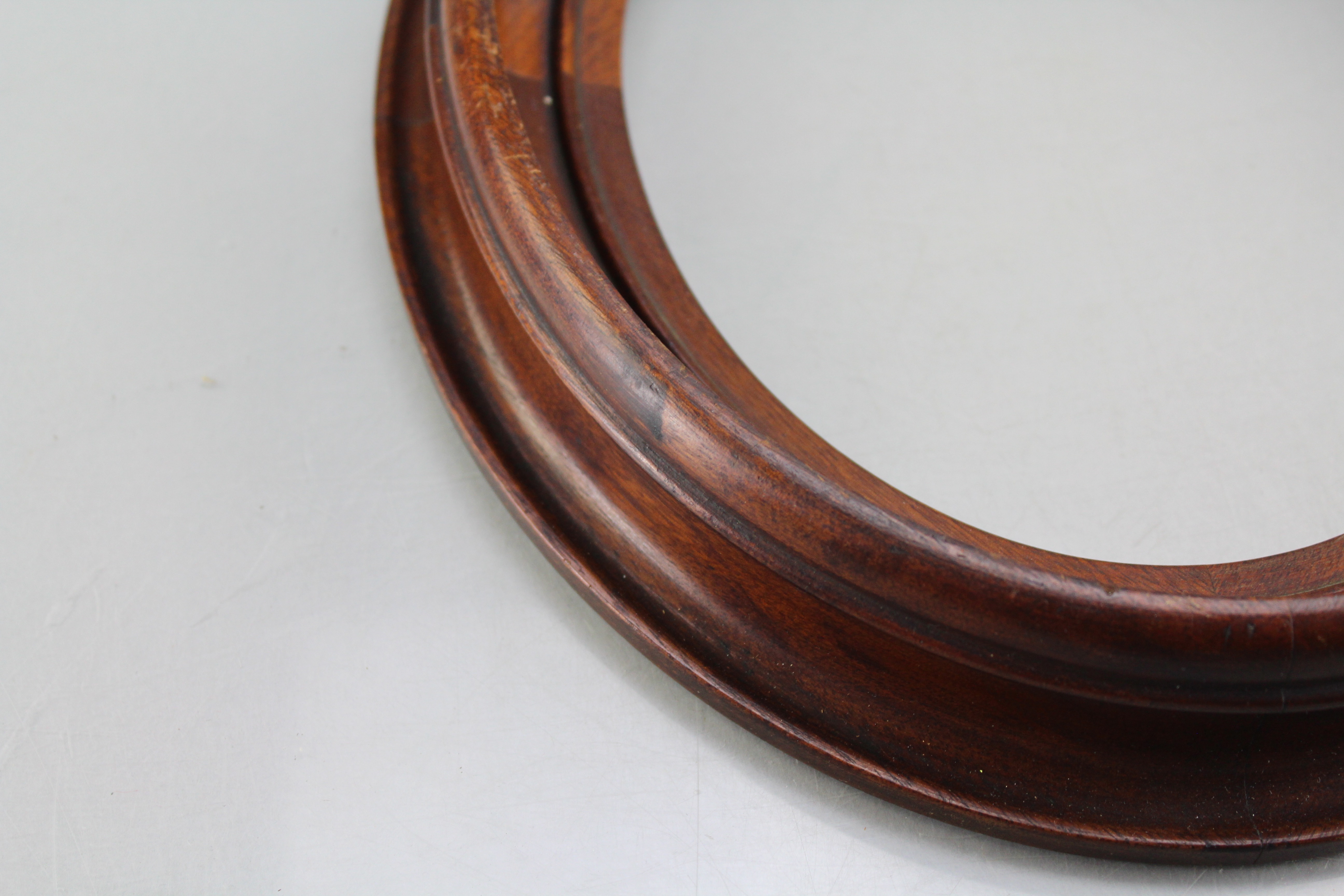 Assortment of Oval Wooden Framed Portrait Photos and Empty Frames