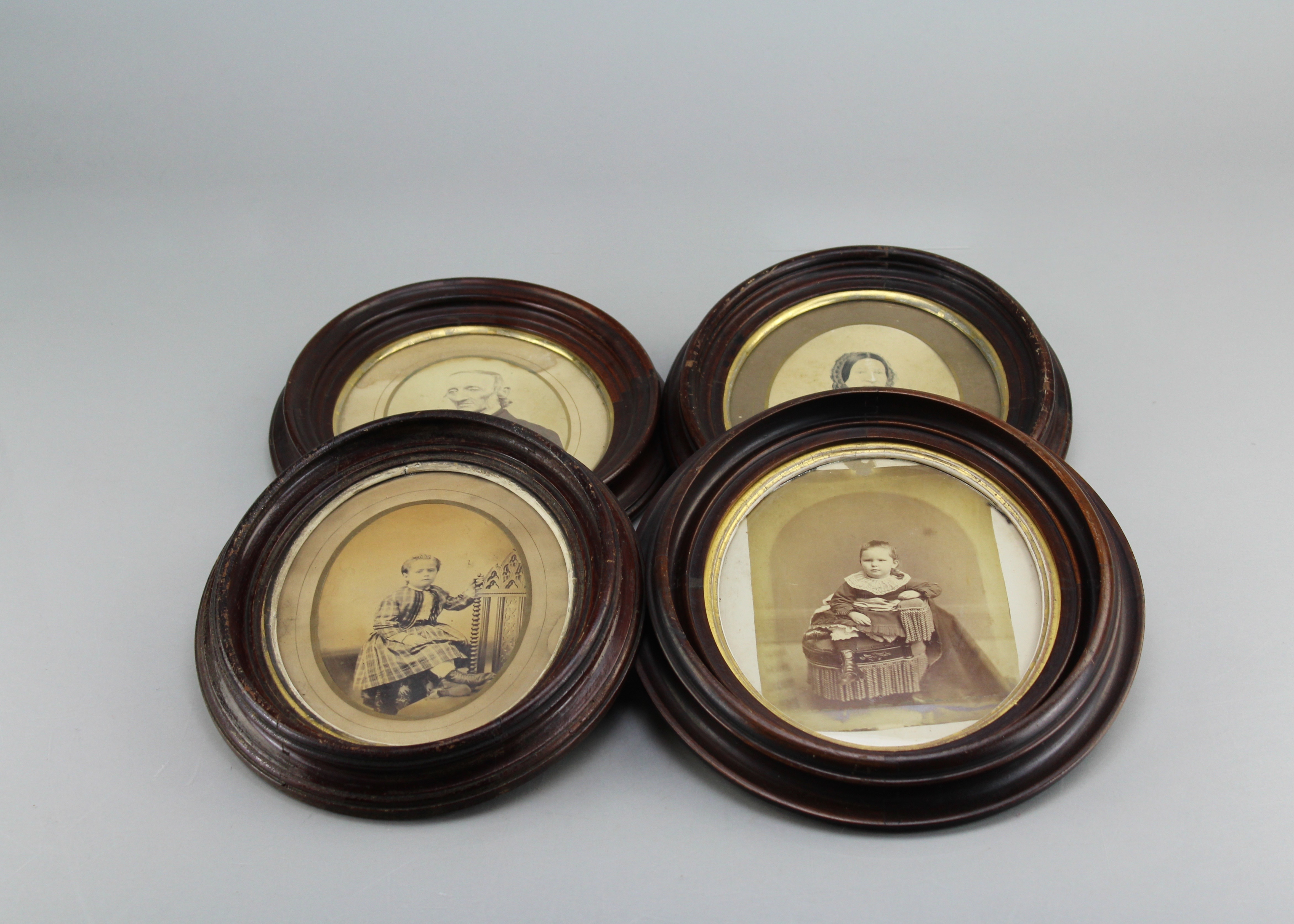 Assortment of Oval Wooden Framed Portrait Photos and Empty Frames