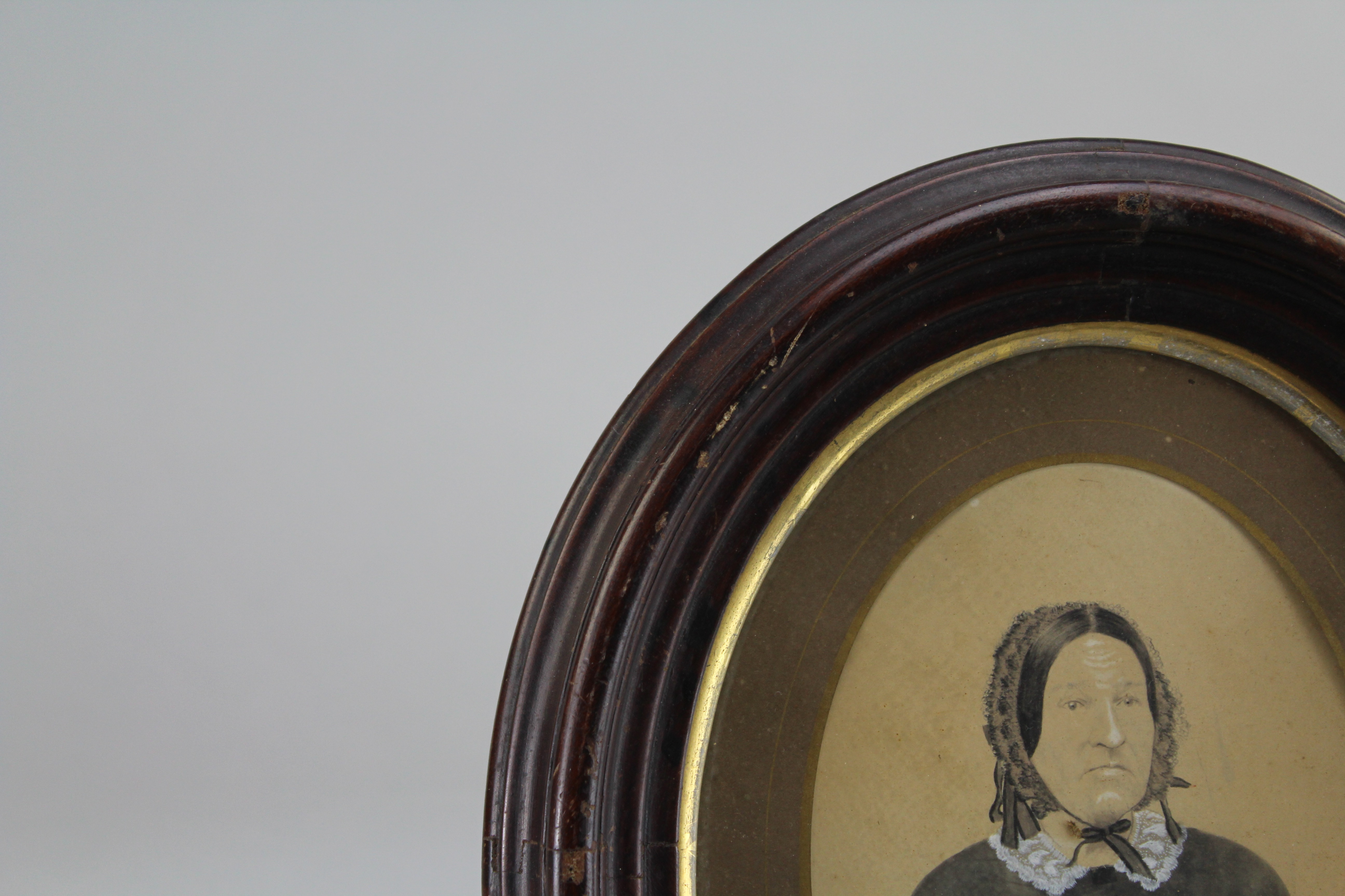 Assortment of Oval Wooden Framed Portrait Photos and Empty Frames