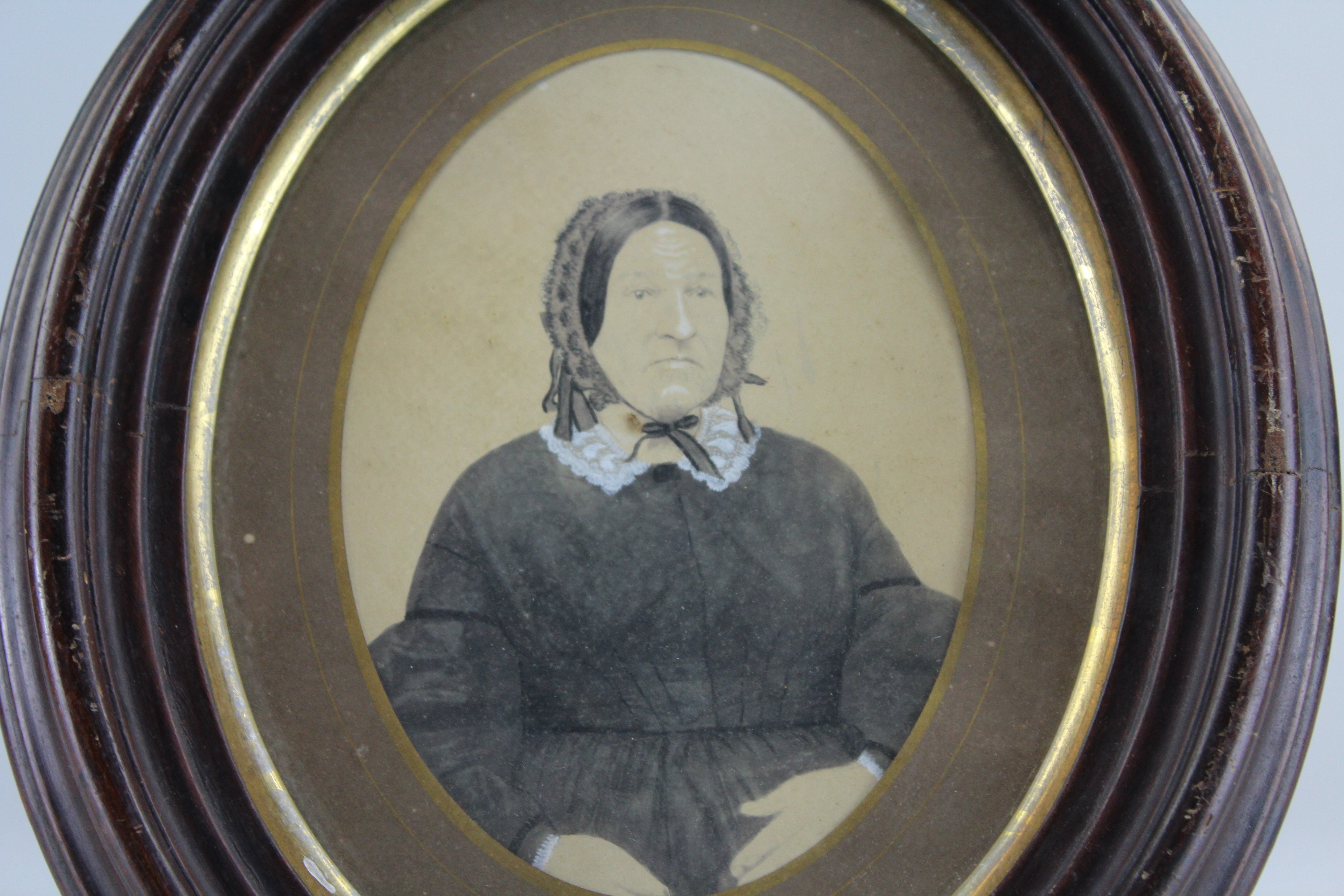 Assortment of Oval Wooden Framed Portrait Photos and Empty Frames