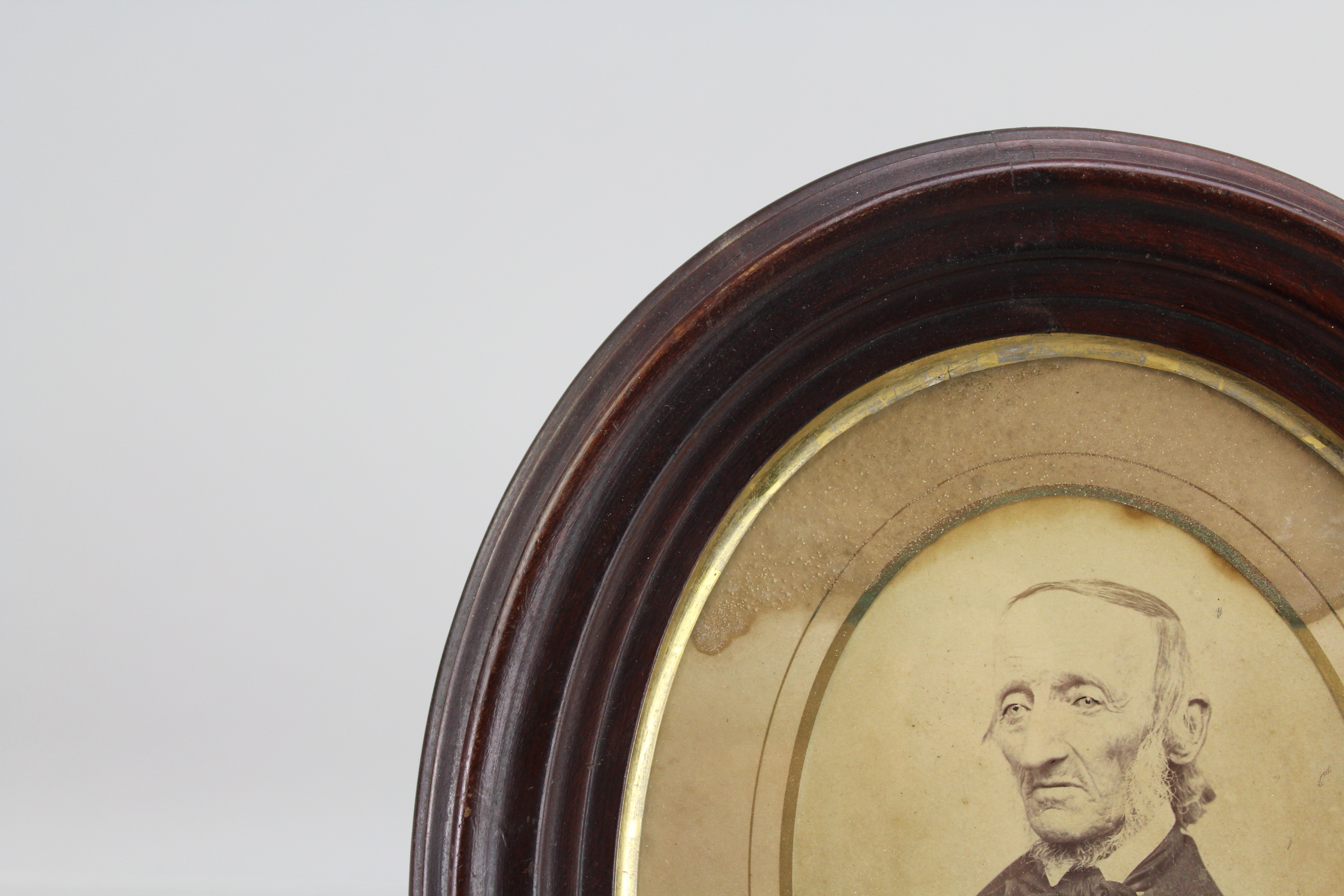 Assortment of Oval Wooden Framed Portrait Photos and Empty Frames