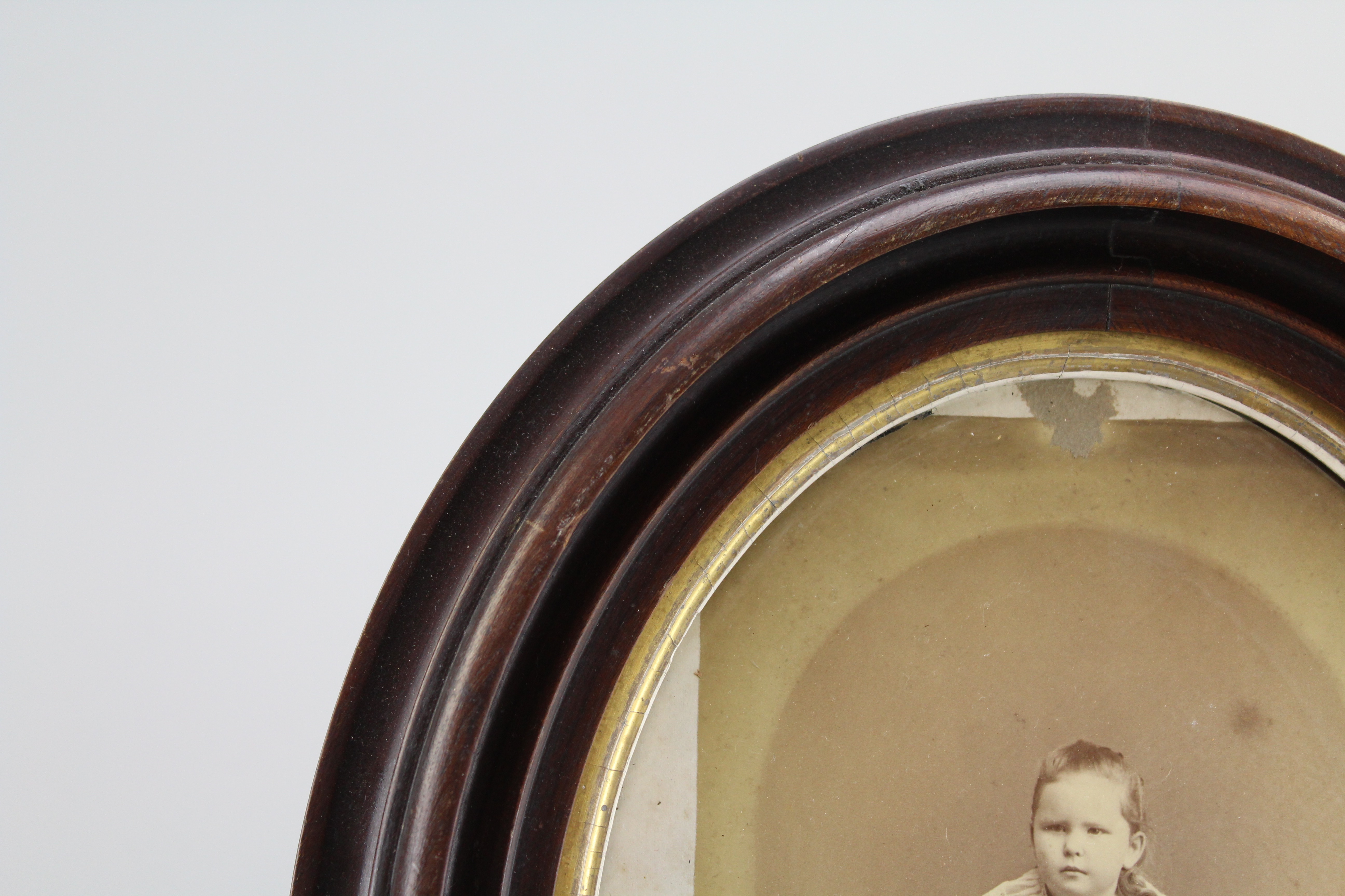 Assortment of Oval Wooden Framed Portrait Photos and Empty Frames