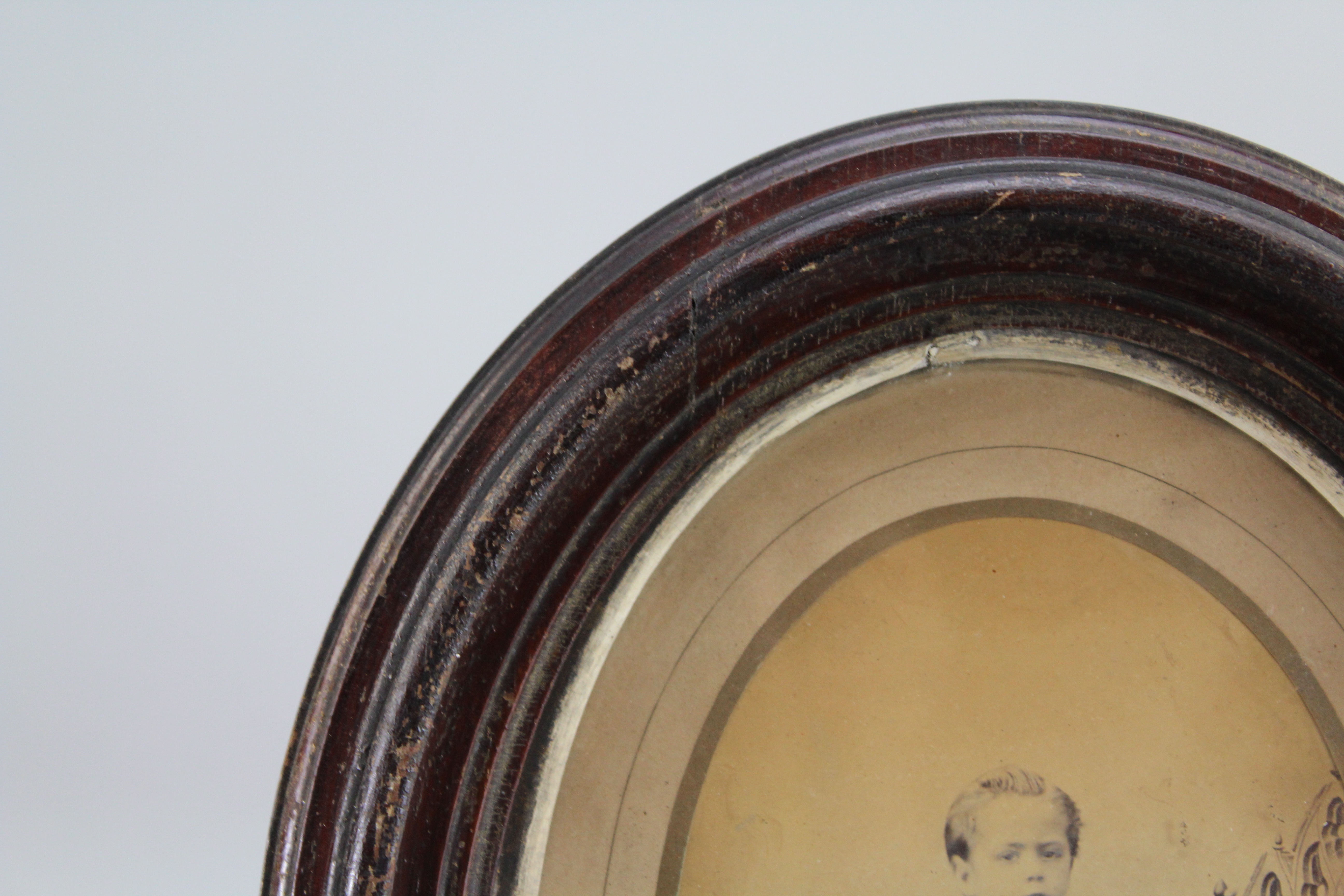 Assortment of Oval Wooden Framed Portrait Photos and Empty Frames