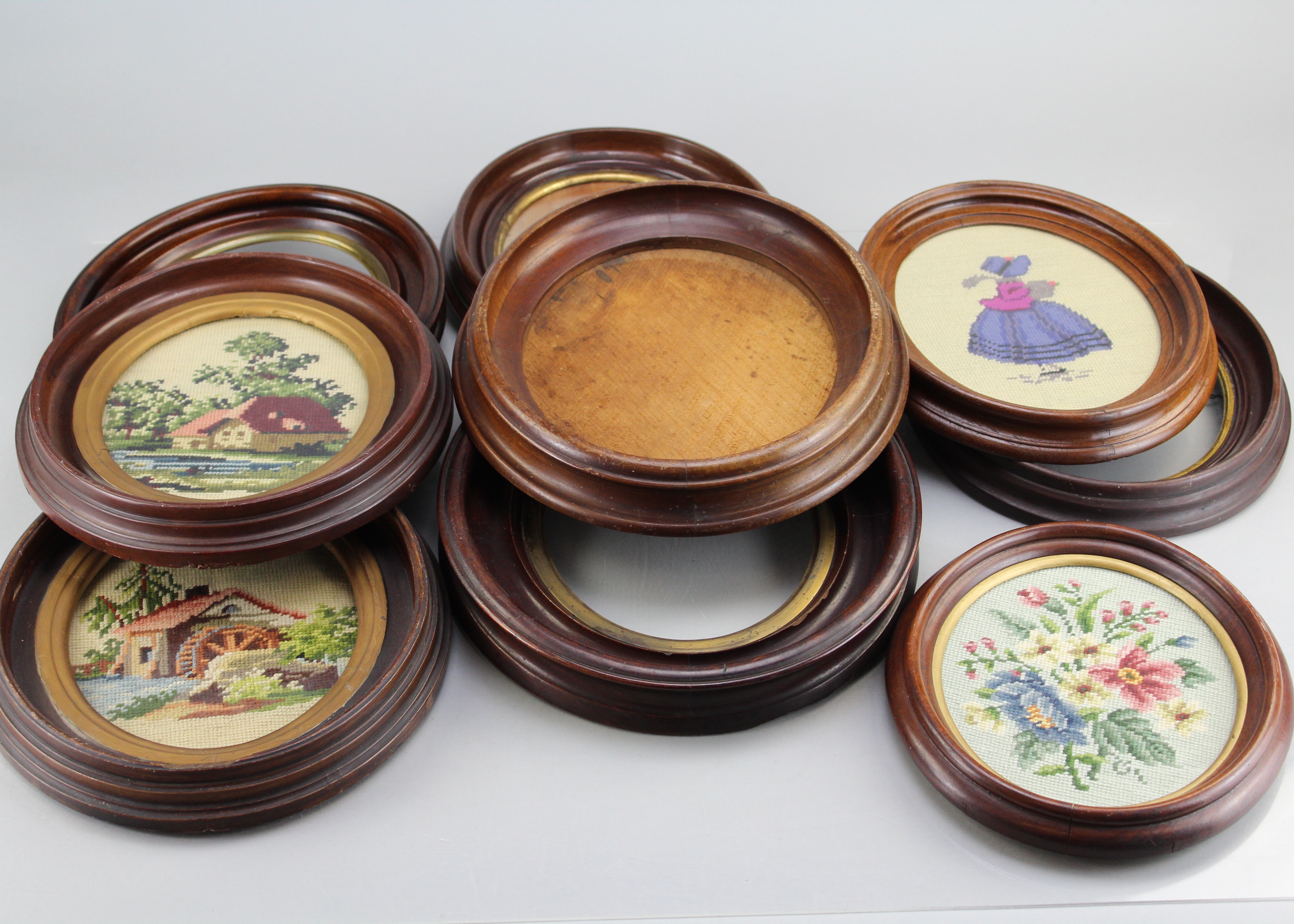 Assortment of Oval Wooden Framed Needle Point Art and Empty Frame