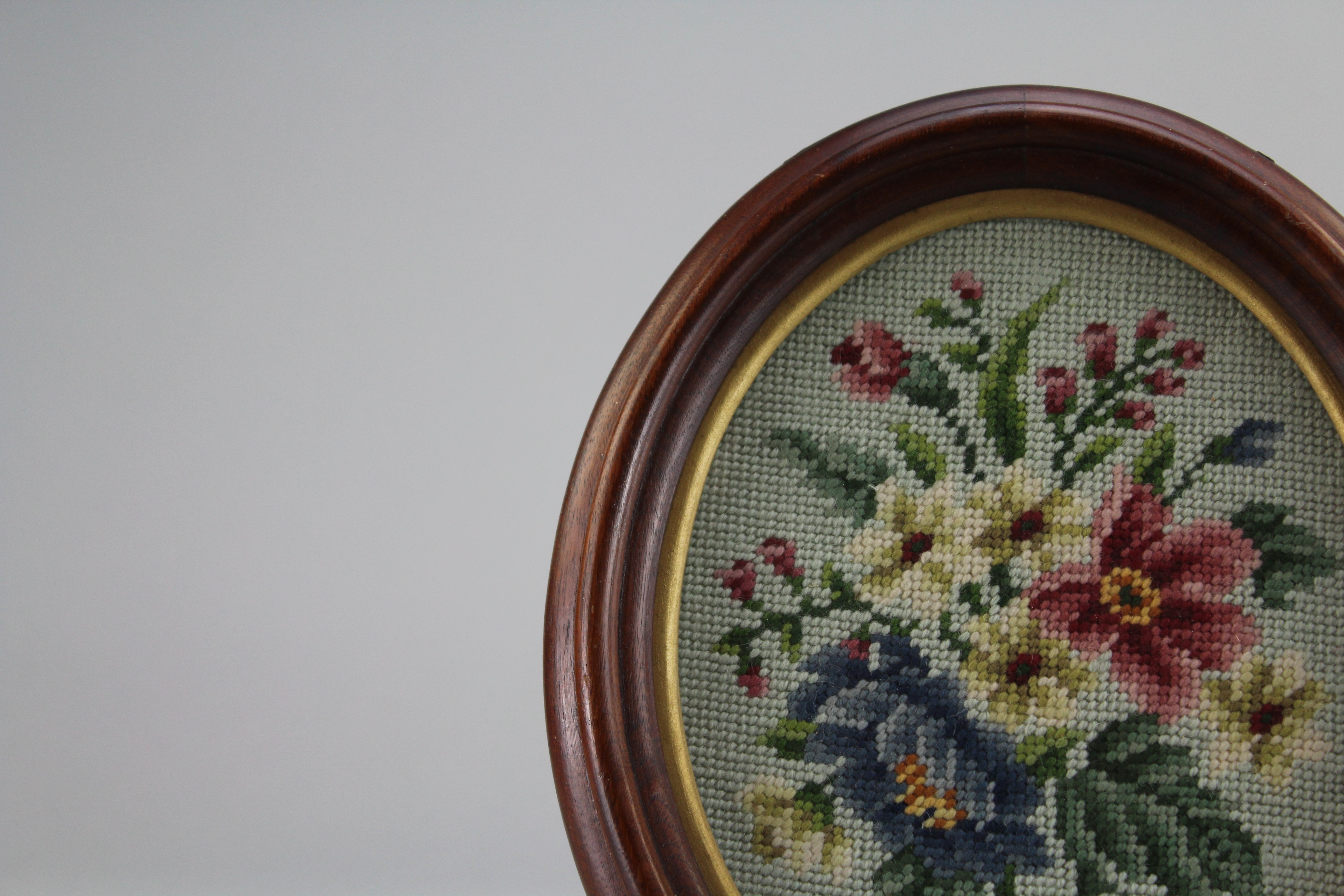 Assortment of Oval Wooden Framed Needle Point Art and Empty Frame