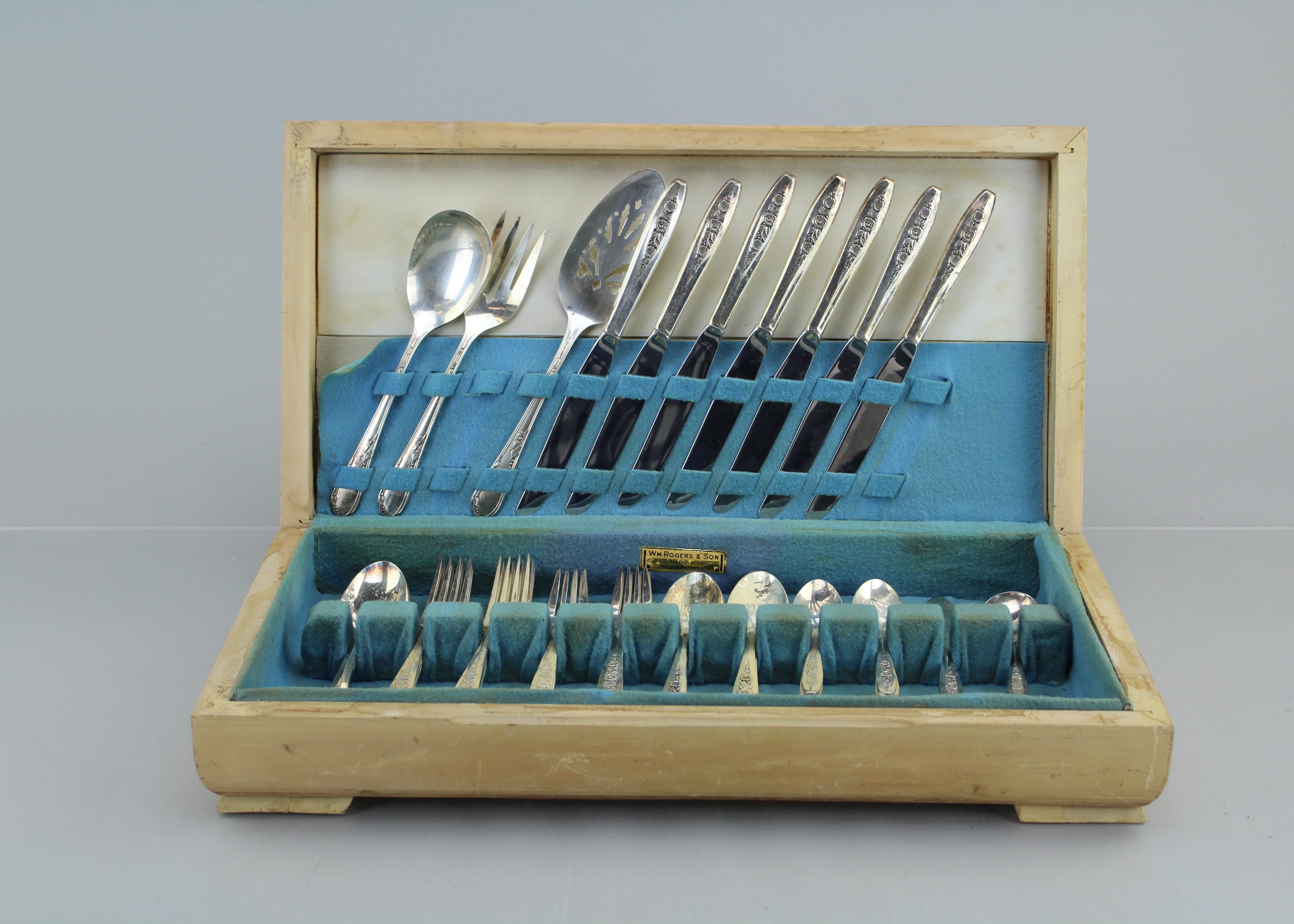 A W.M. Rogers and Son Silverplate Flatware Set in Pine Wooden Box