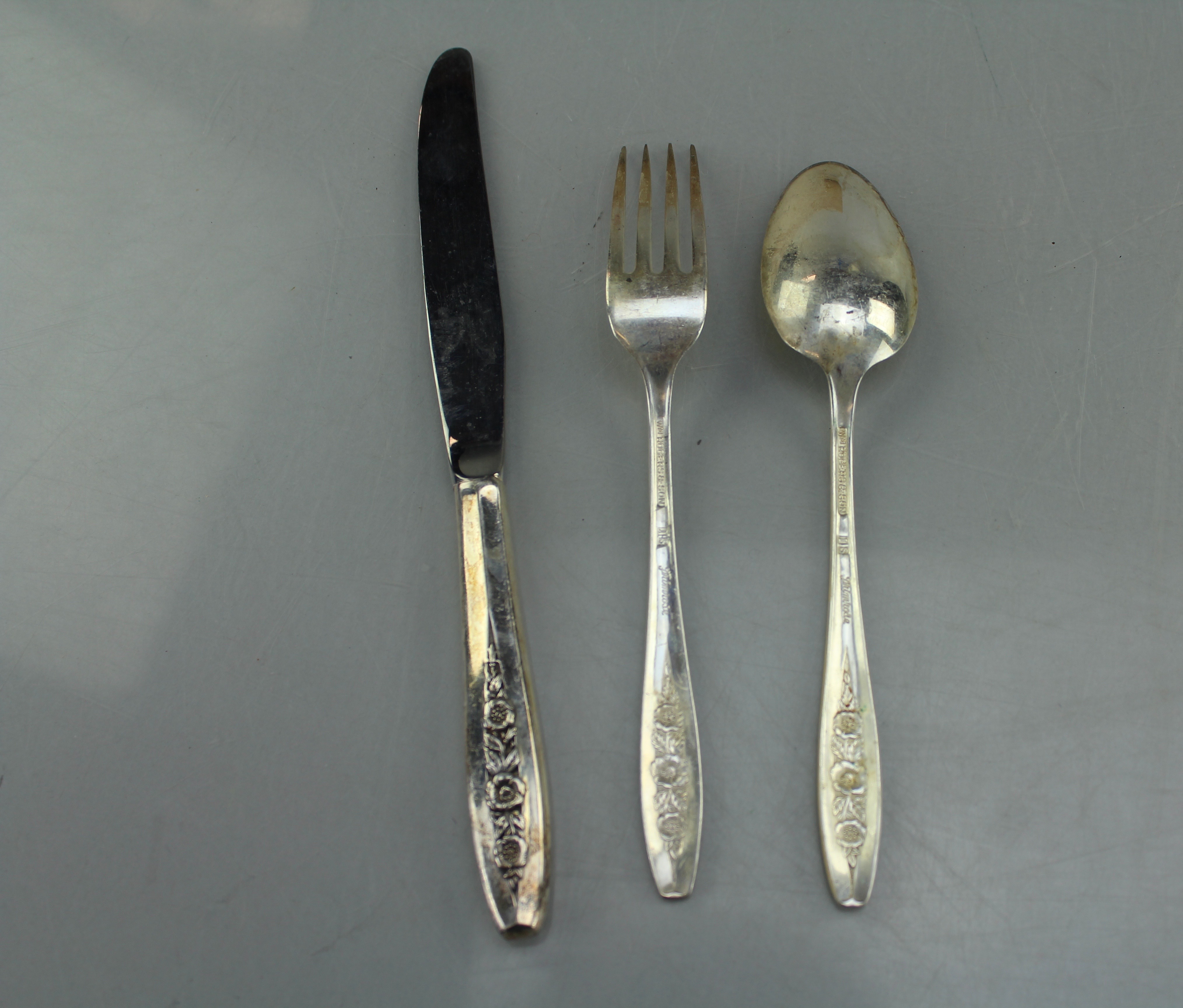 A W.M. Rogers and Son Silverplate Flatware Set in Pine Wooden Box