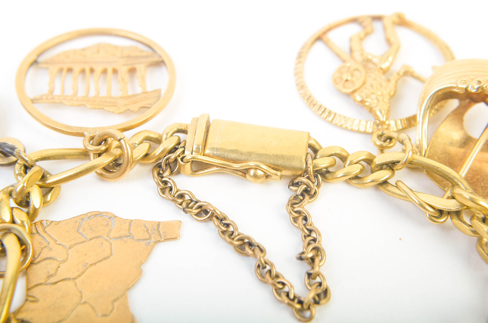 Gold Tone Charm Bracelet with 10K-18K Gold Charms