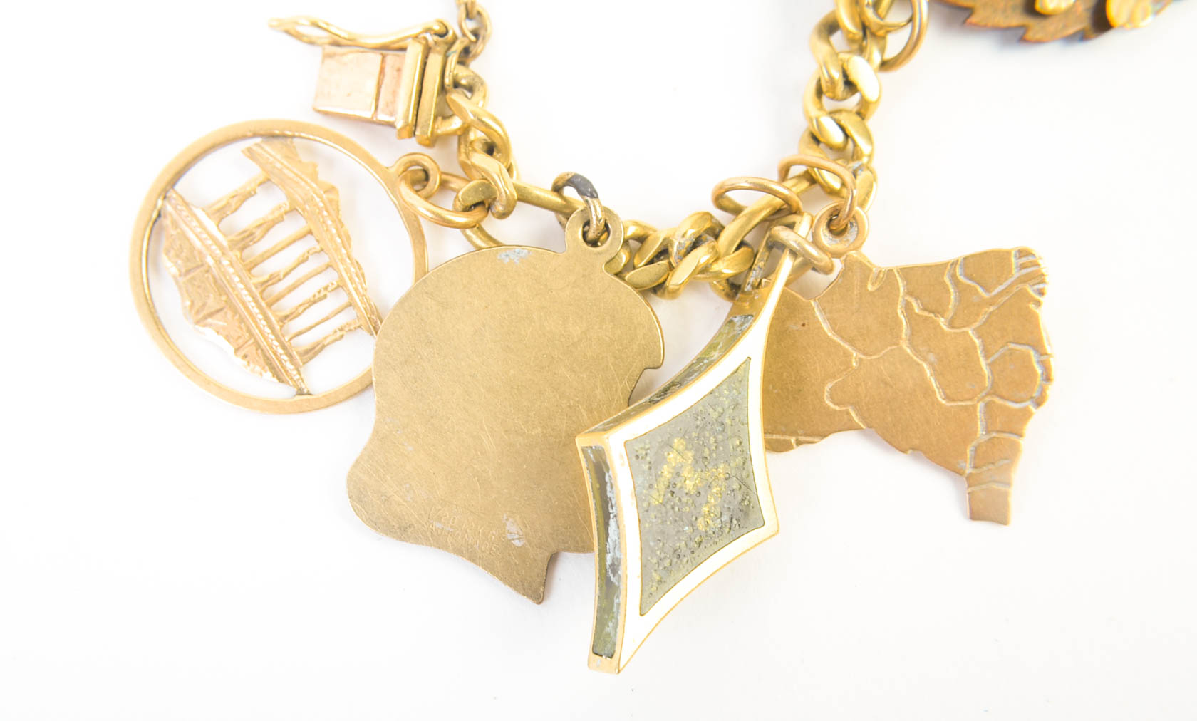 Gold Tone Charm Bracelet with 10K-18K Gold Charms