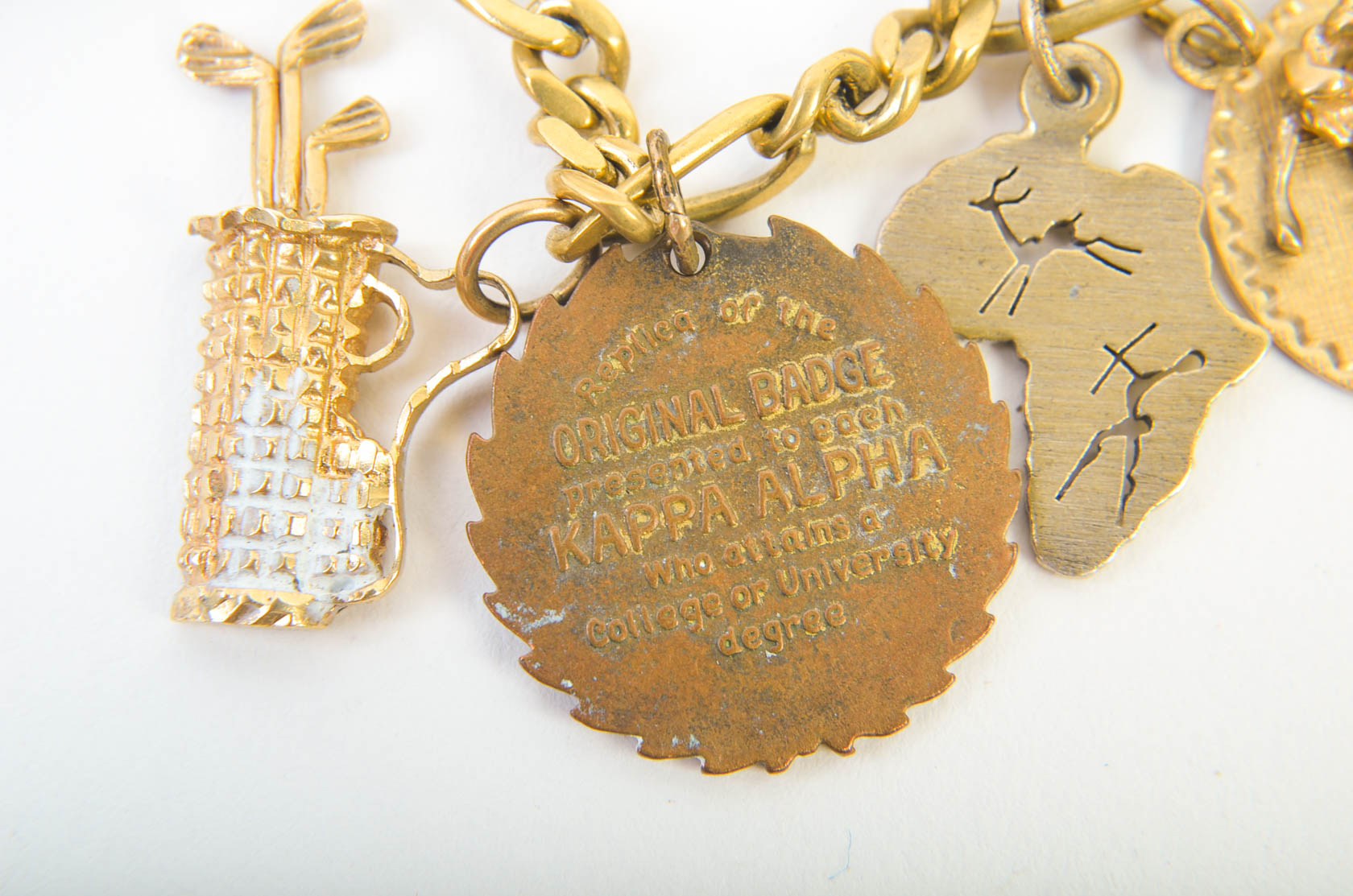 Gold Tone Charm Bracelet with 10K-18K Gold Charms