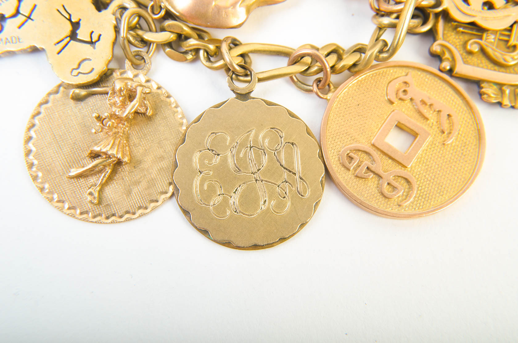 Gold Tone Charm Bracelet with 10K-18K Gold Charms