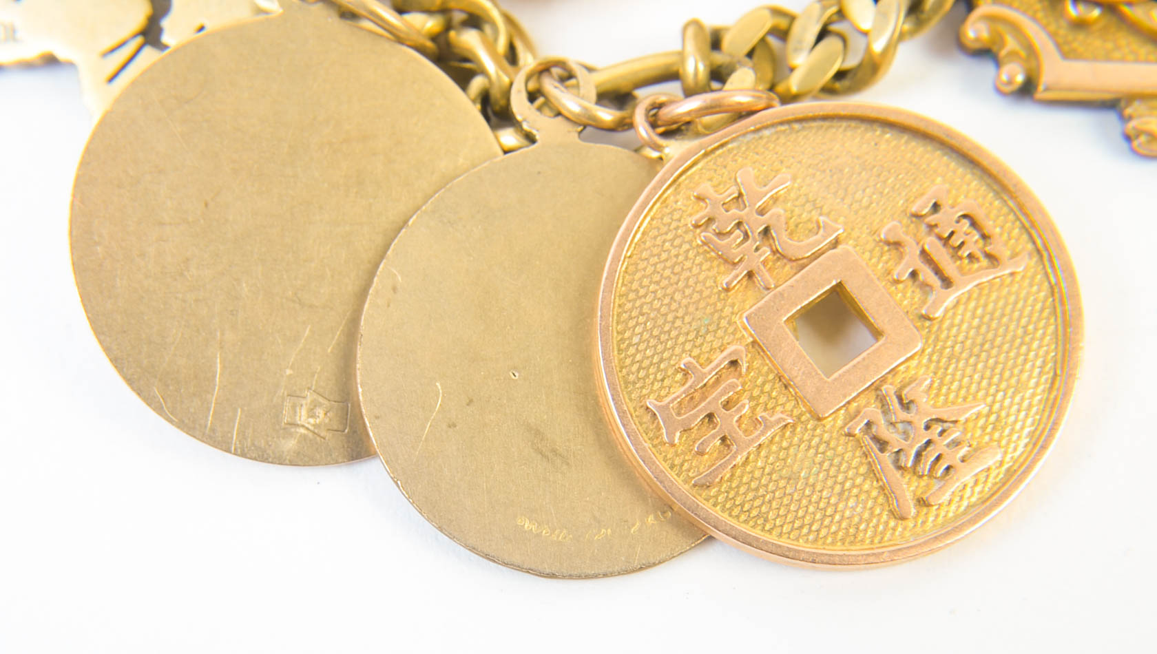 Gold Tone Charm Bracelet with 10K-18K Gold Charms