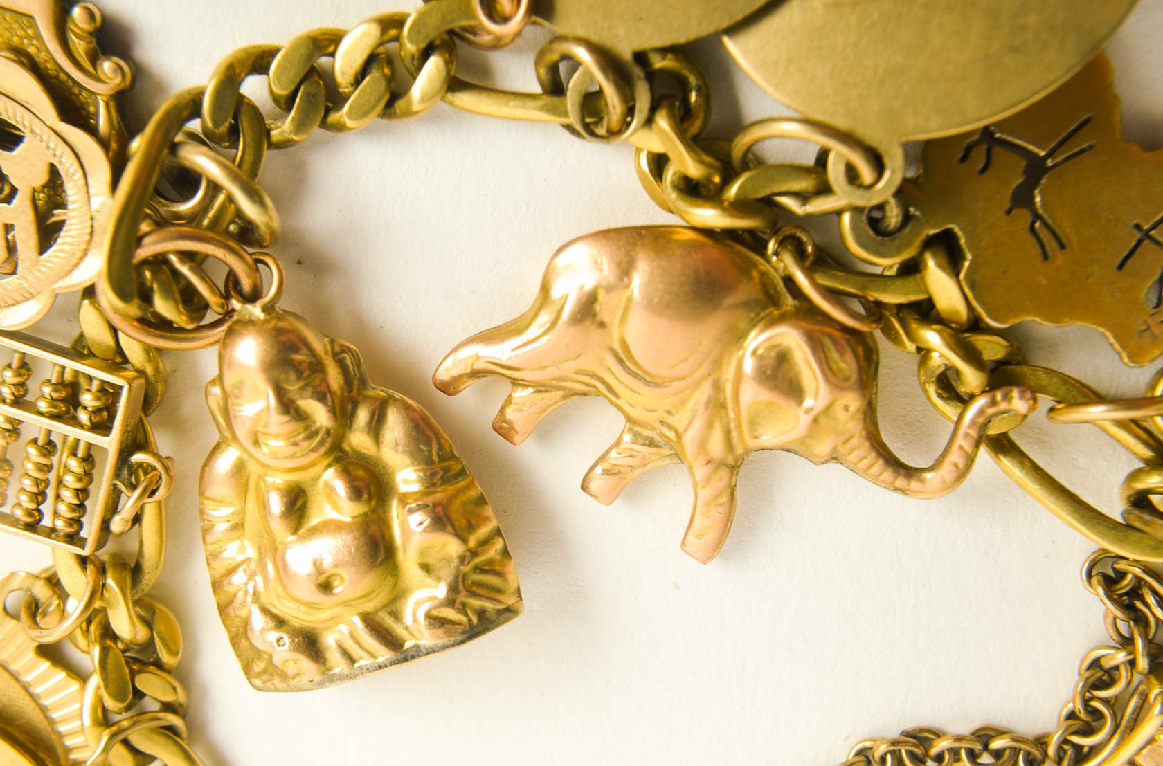 Gold Tone Charm Bracelet with 10K-18K Gold Charms