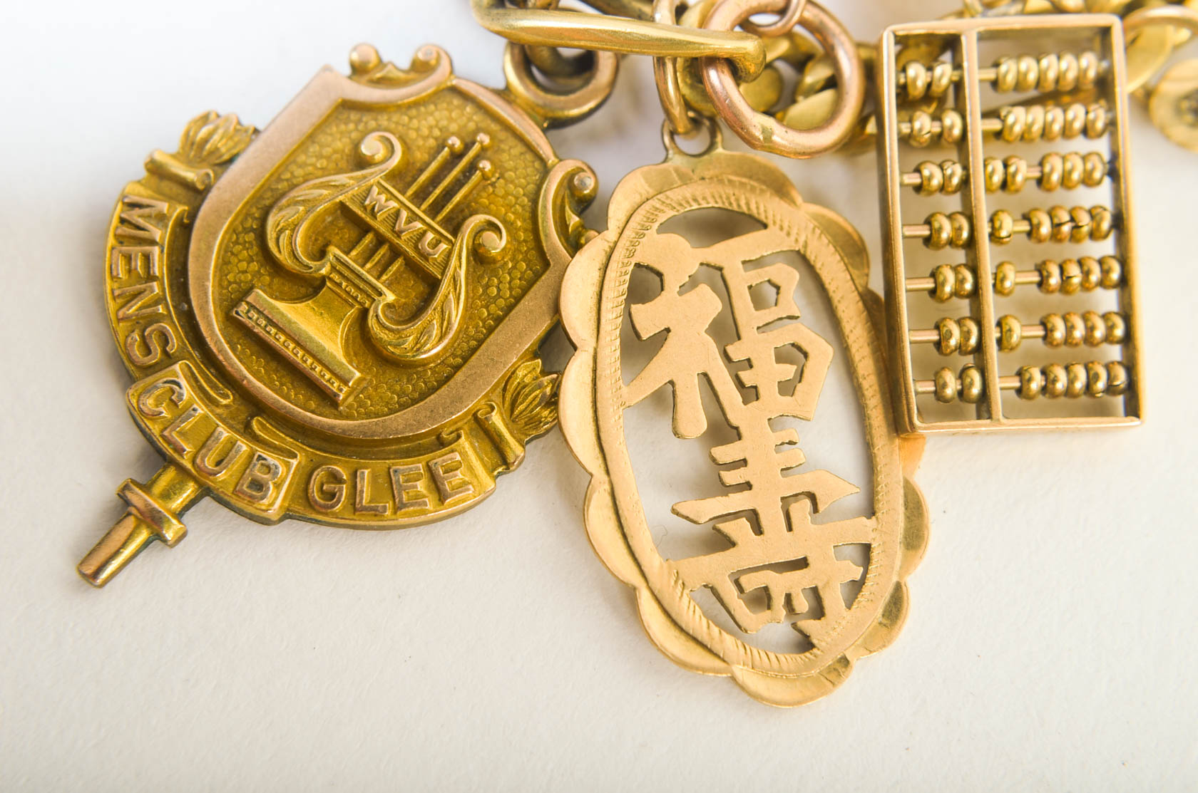 Gold Tone Charm Bracelet with 10K-18K Gold Charms