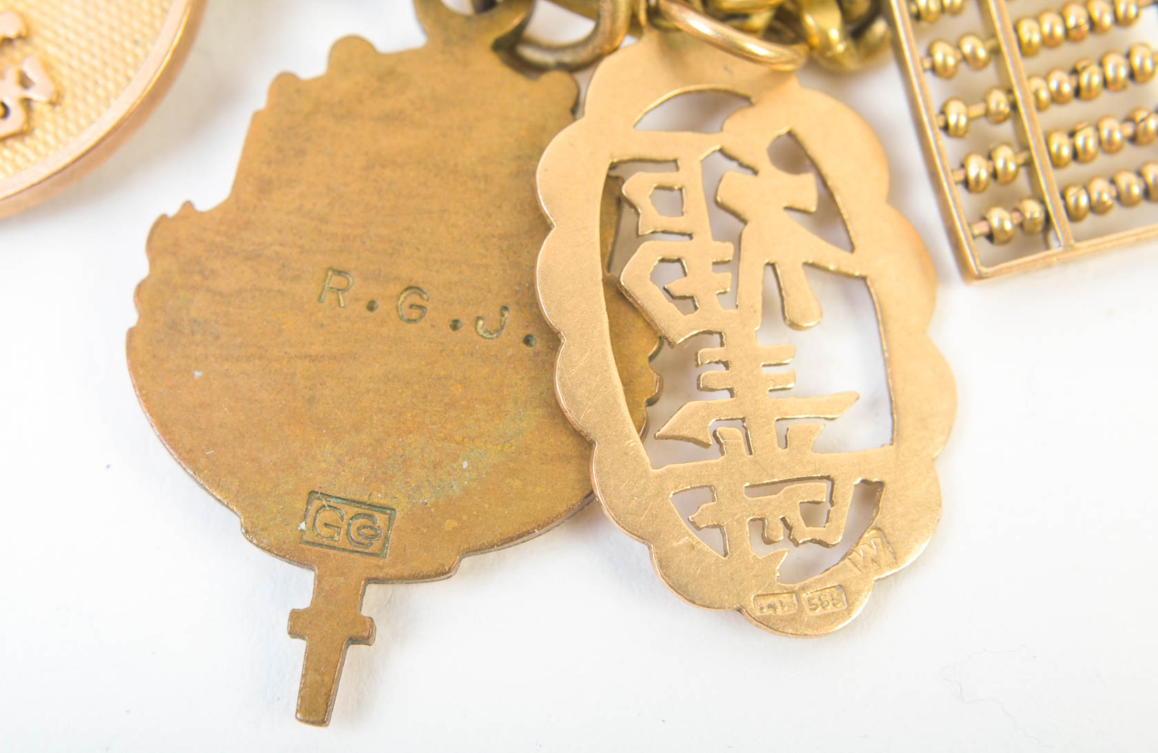 Gold Tone Charm Bracelet with 10K-18K Gold Charms