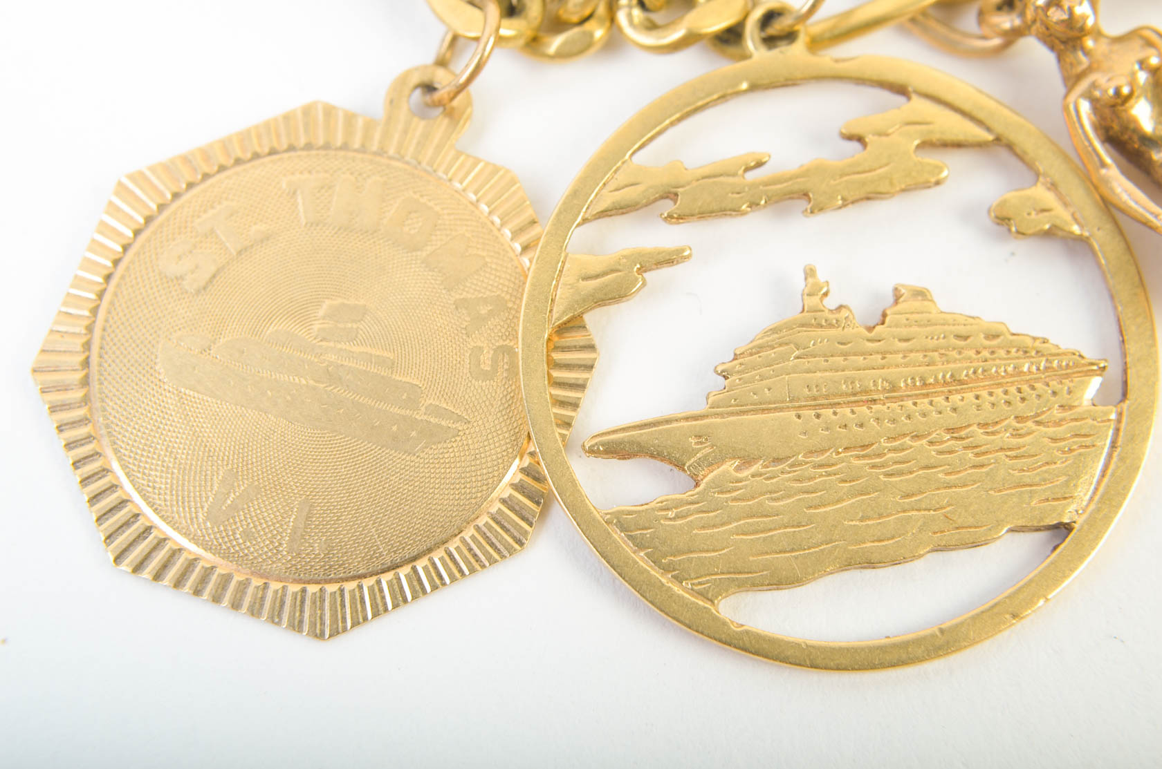 Gold Tone Charm Bracelet with 10K-18K Gold Charms