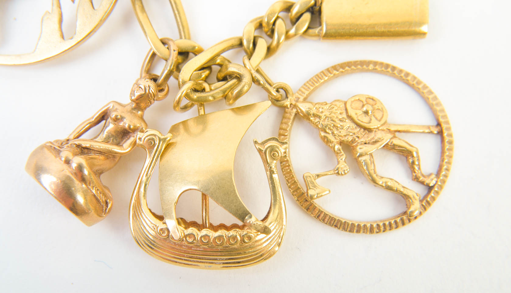 Gold Tone Charm Bracelet with 10K-18K Gold Charms