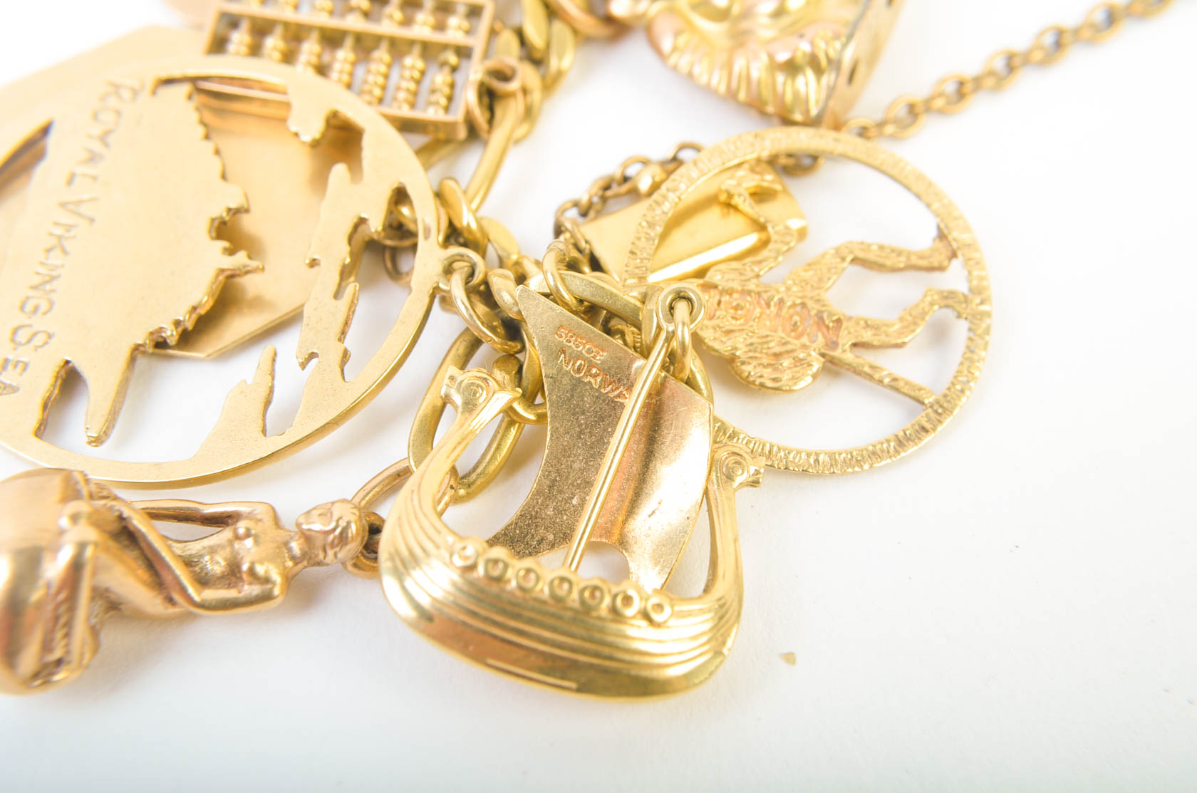 Gold Tone Charm Bracelet with 10K-18K Gold Charms