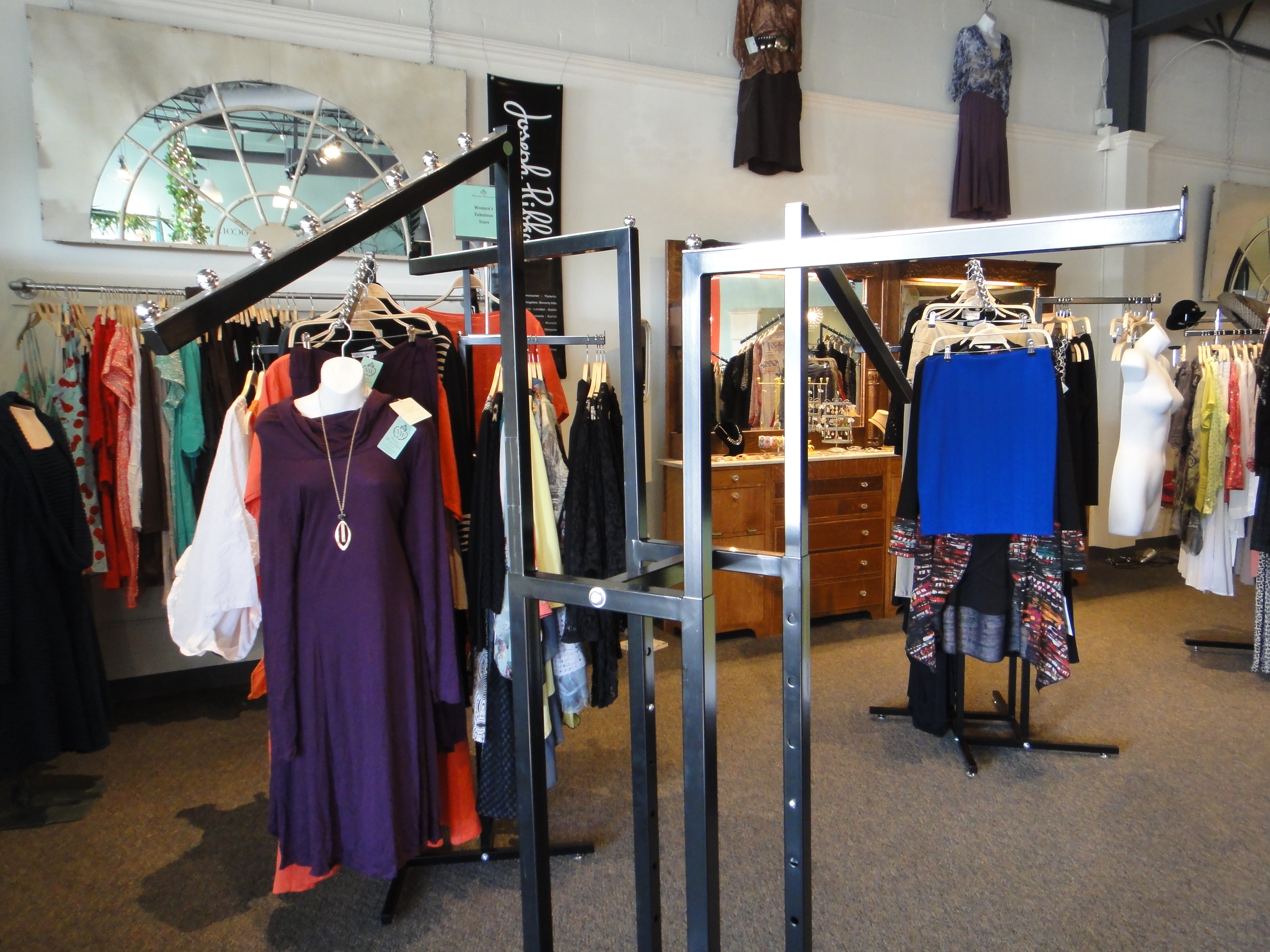 Two Commercial Grade Four Arm Metal Clothing Rack