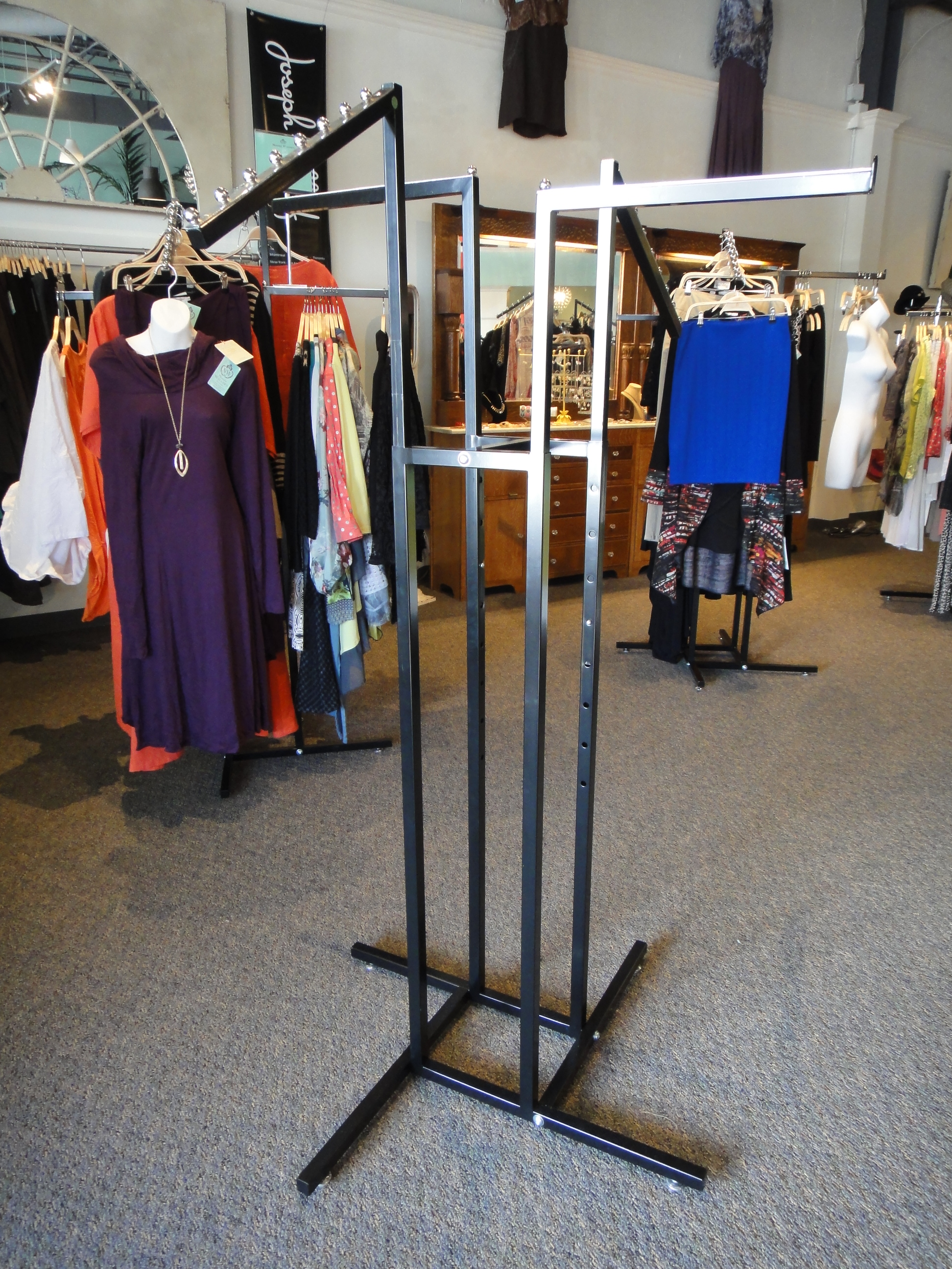 Two Commercial Grade Four Arm Metal Clothing Rack