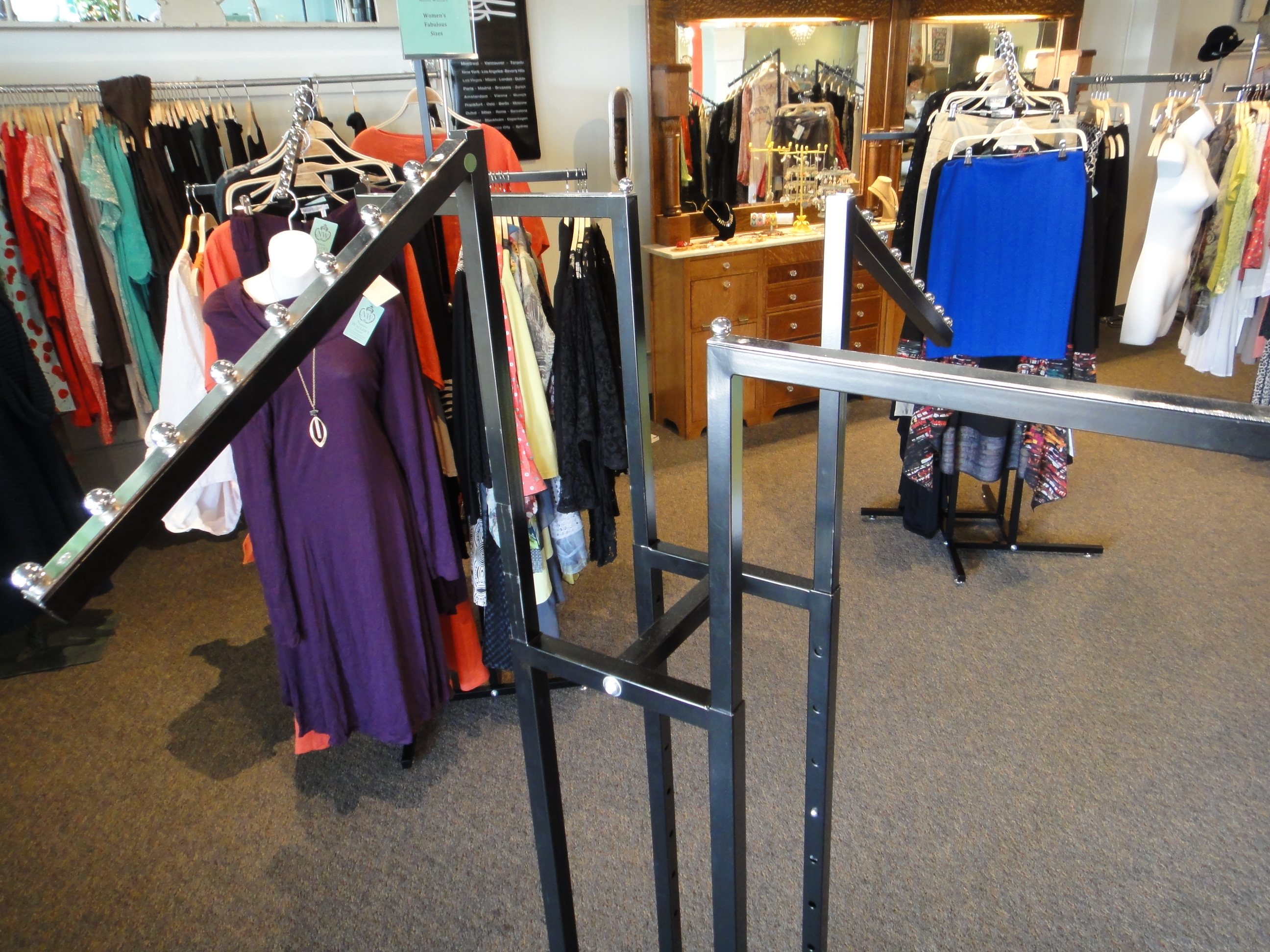 Two Commercial Grade Four Arm Metal Clothing Rack