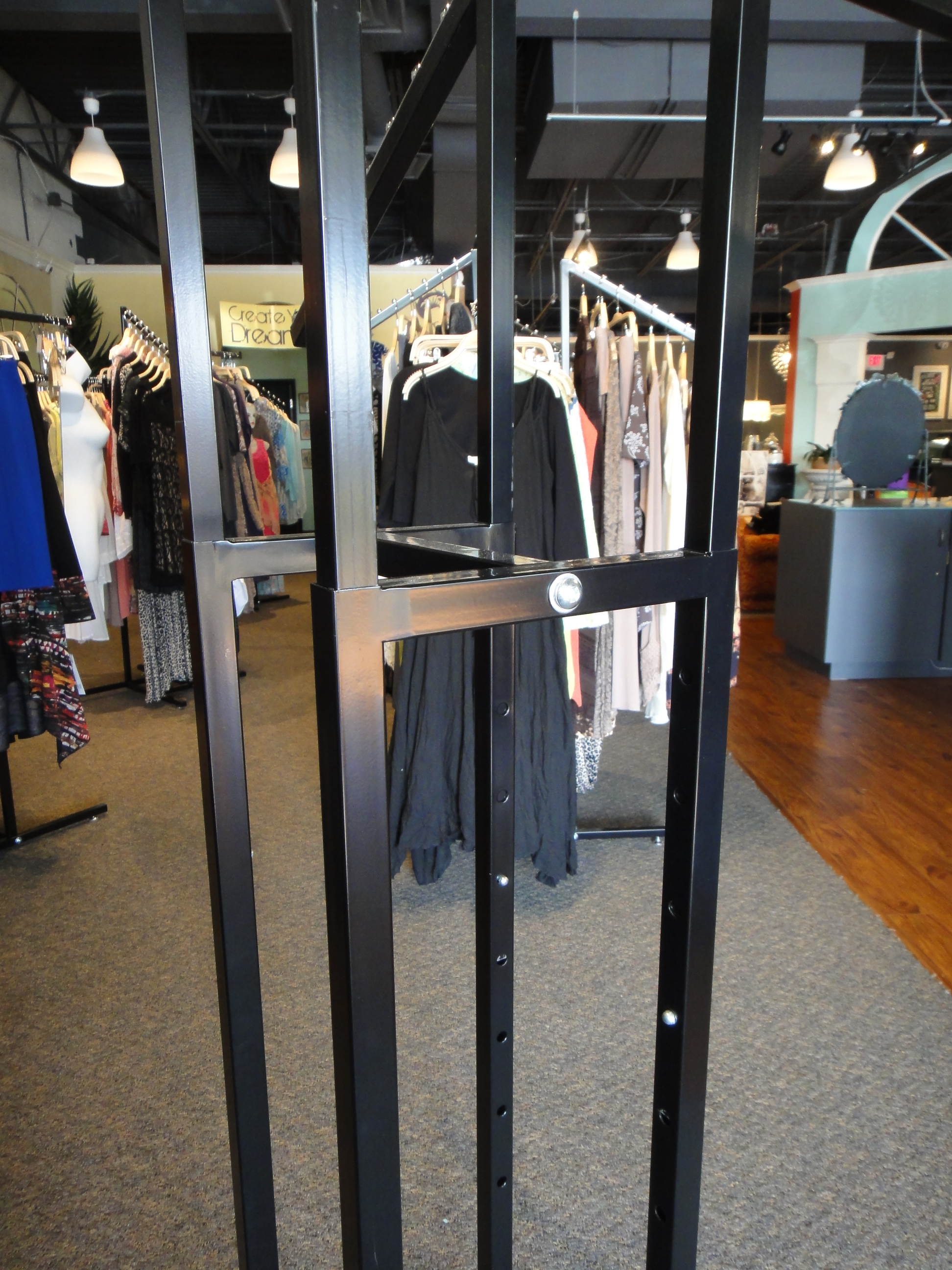 Two Commercial Grade Four Arm Metal Clothing Rack