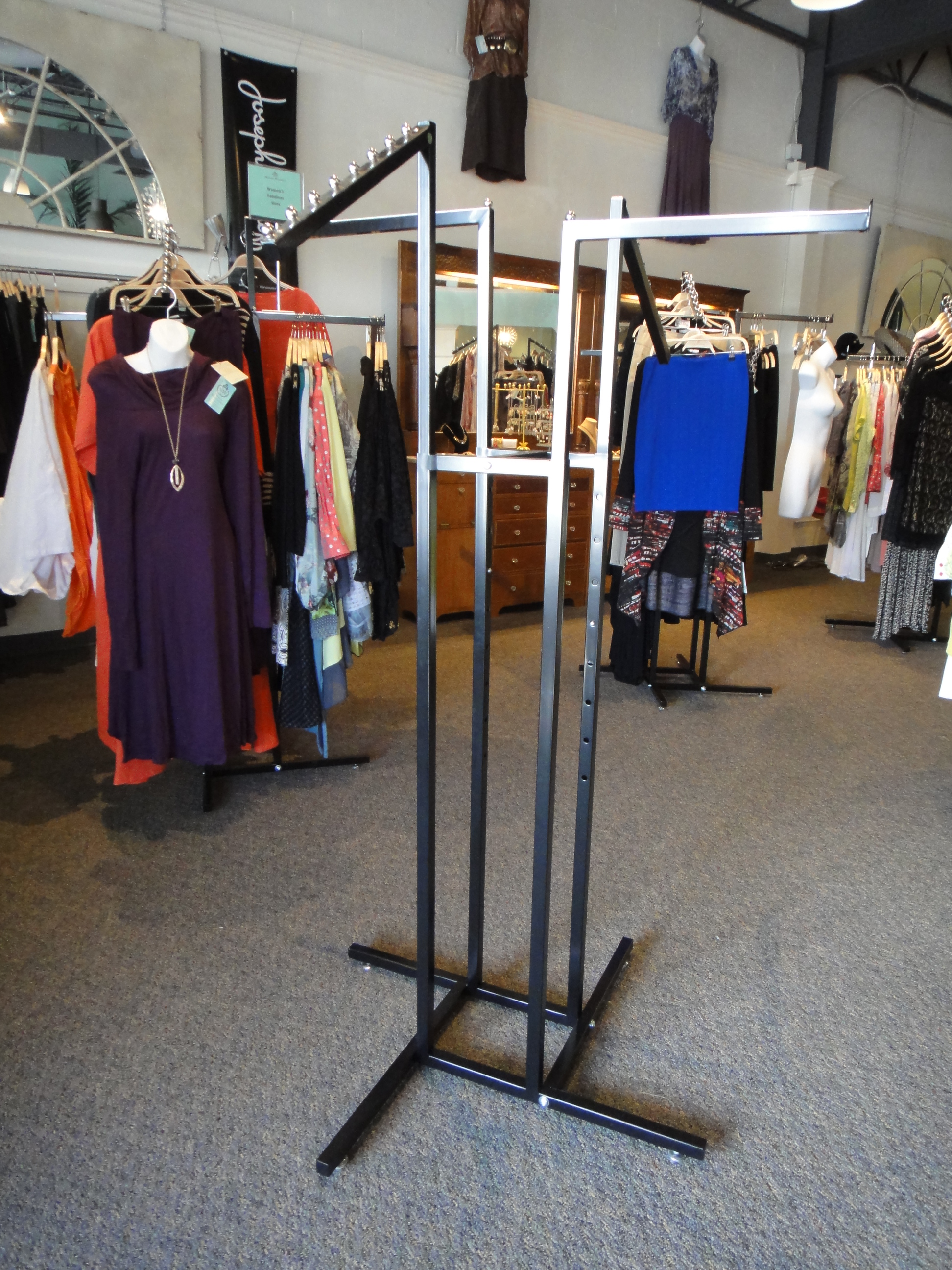Two Commercial Grade Four Arm Metal Clothing Rack