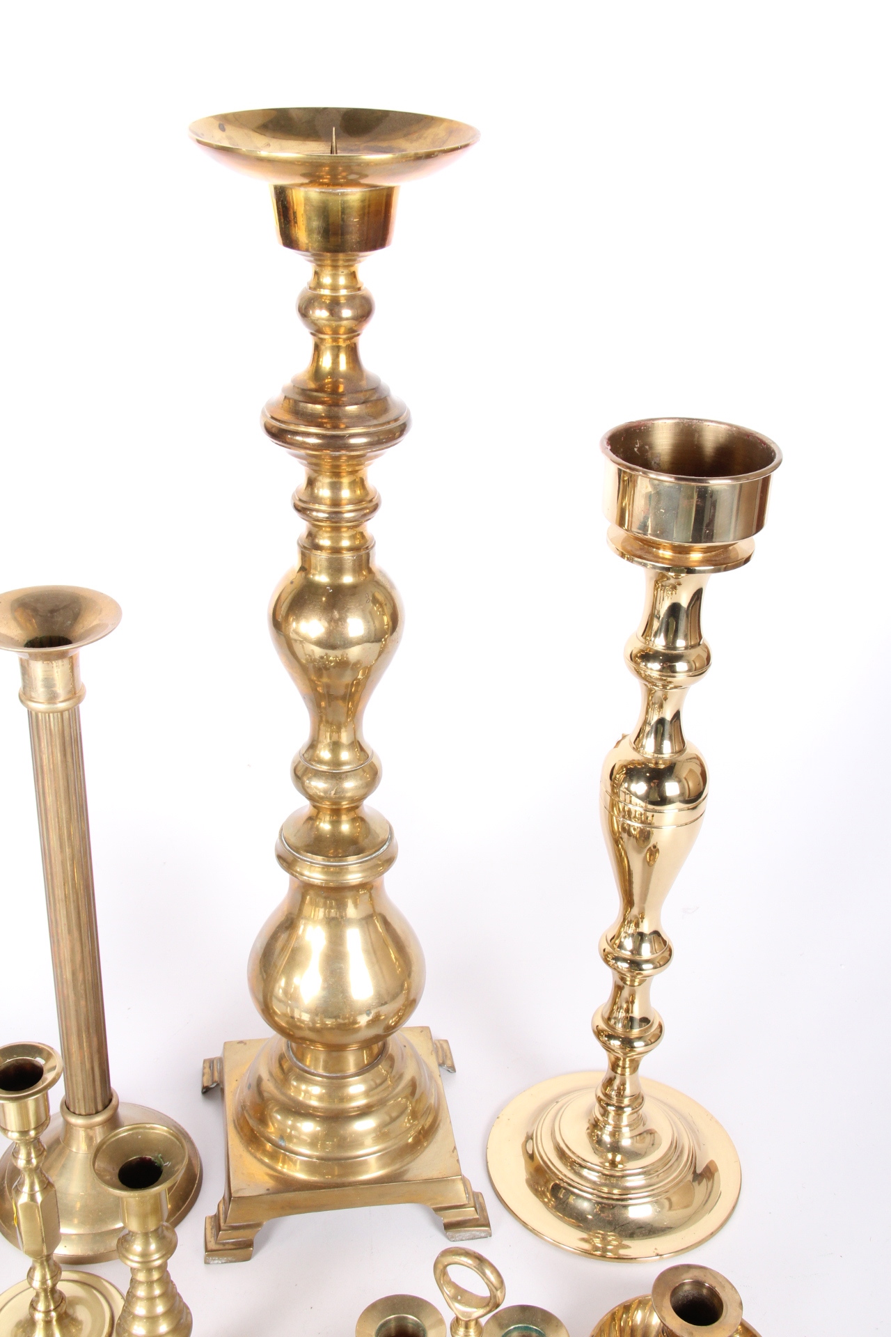 Generous Collection of Brass Candle Holders