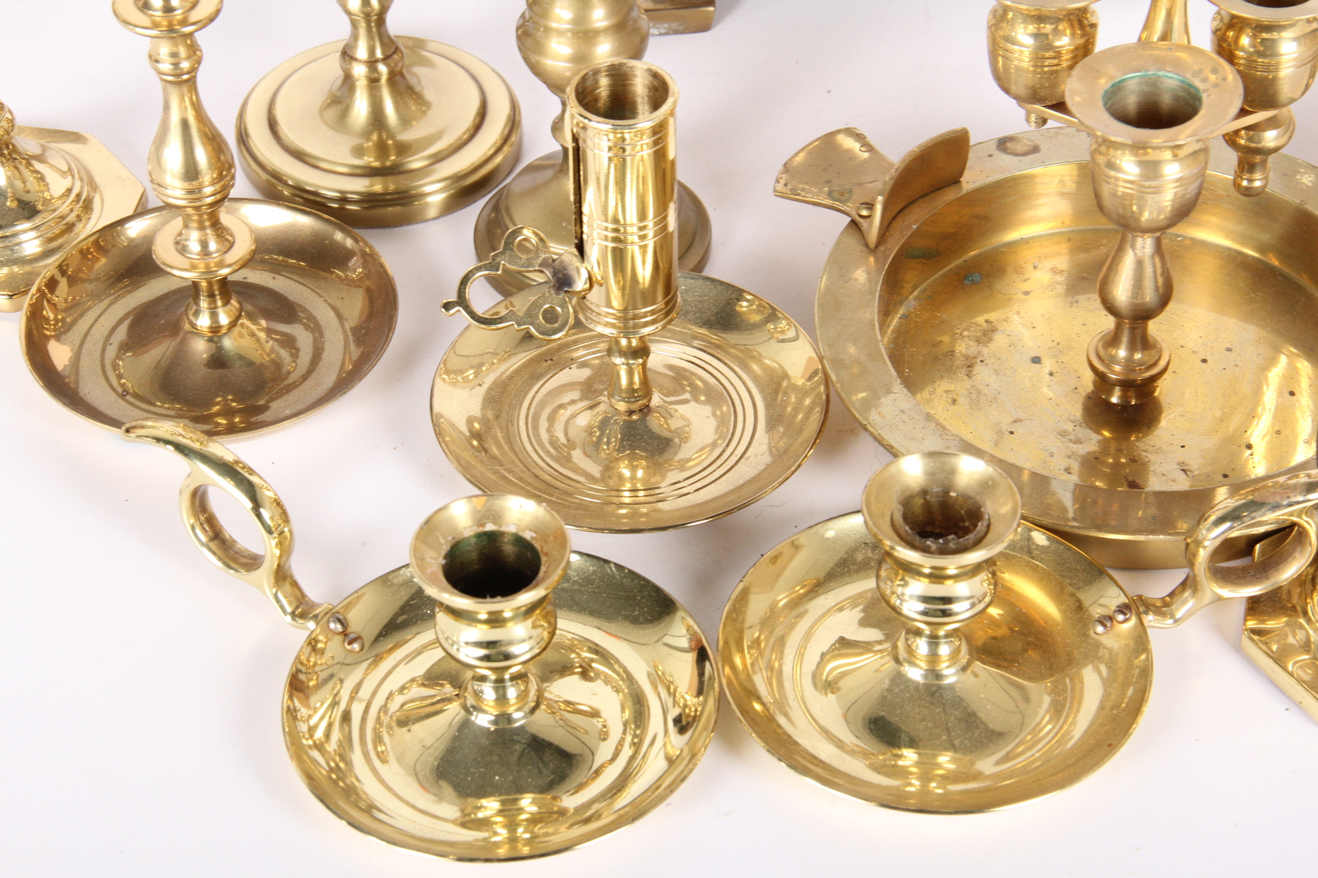 Generous Collection of Brass Candle Holders
