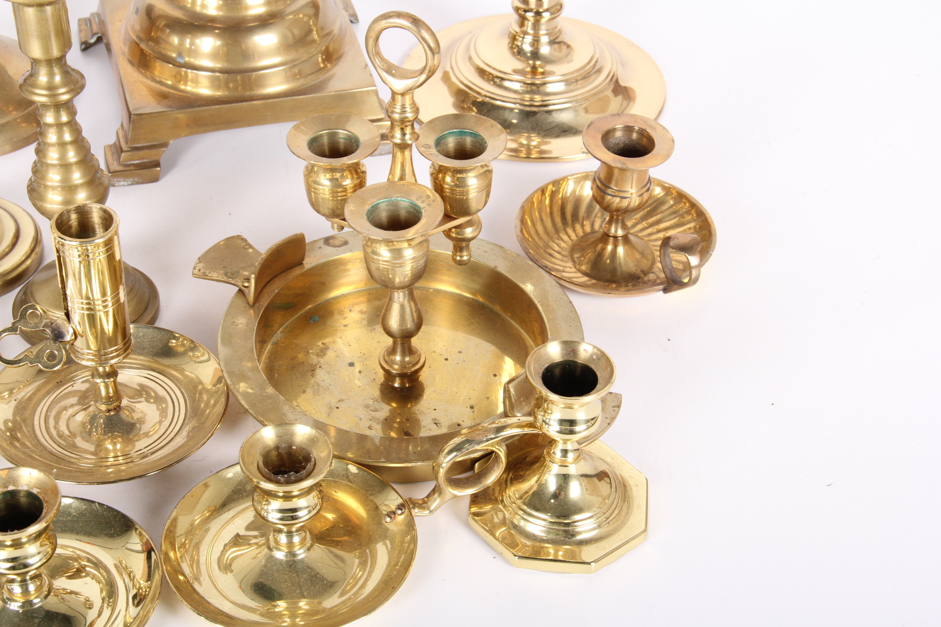 Generous Collection of Brass Candle Holders
