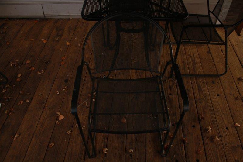Black Metal Patio Table with Three Chairs