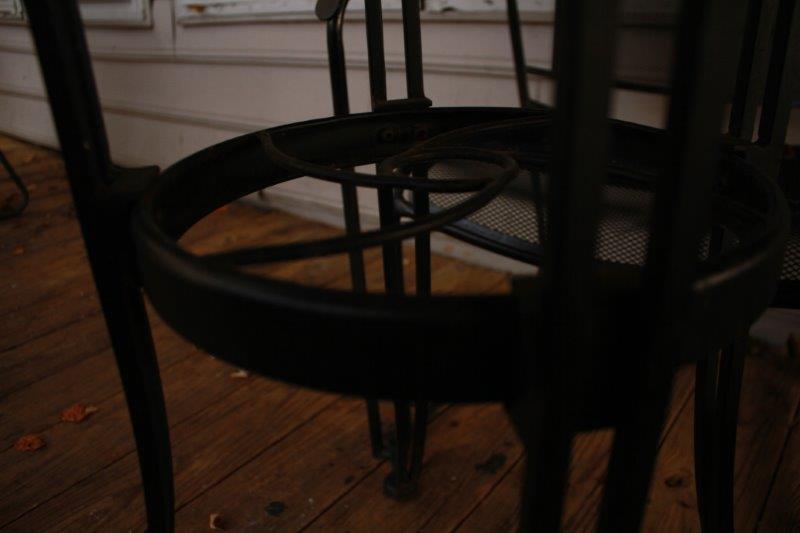 Black Metal Patio Table with Three Chairs