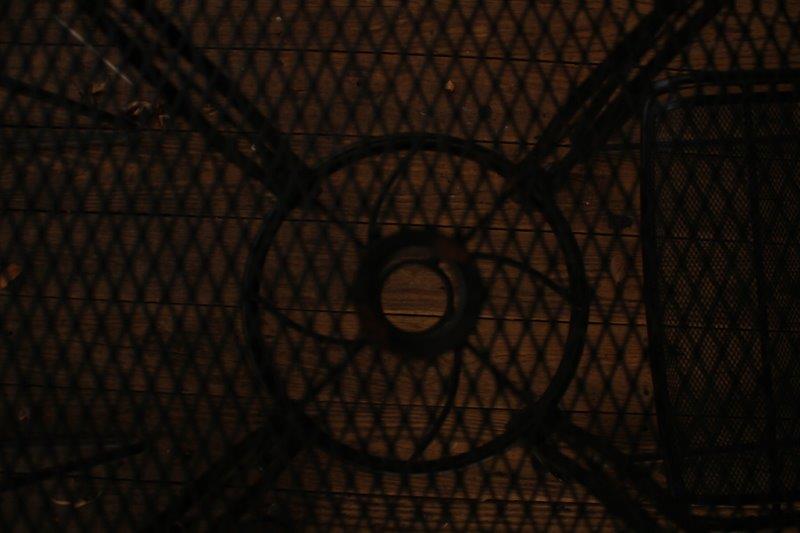 Black Metal Patio Table with Three Chairs