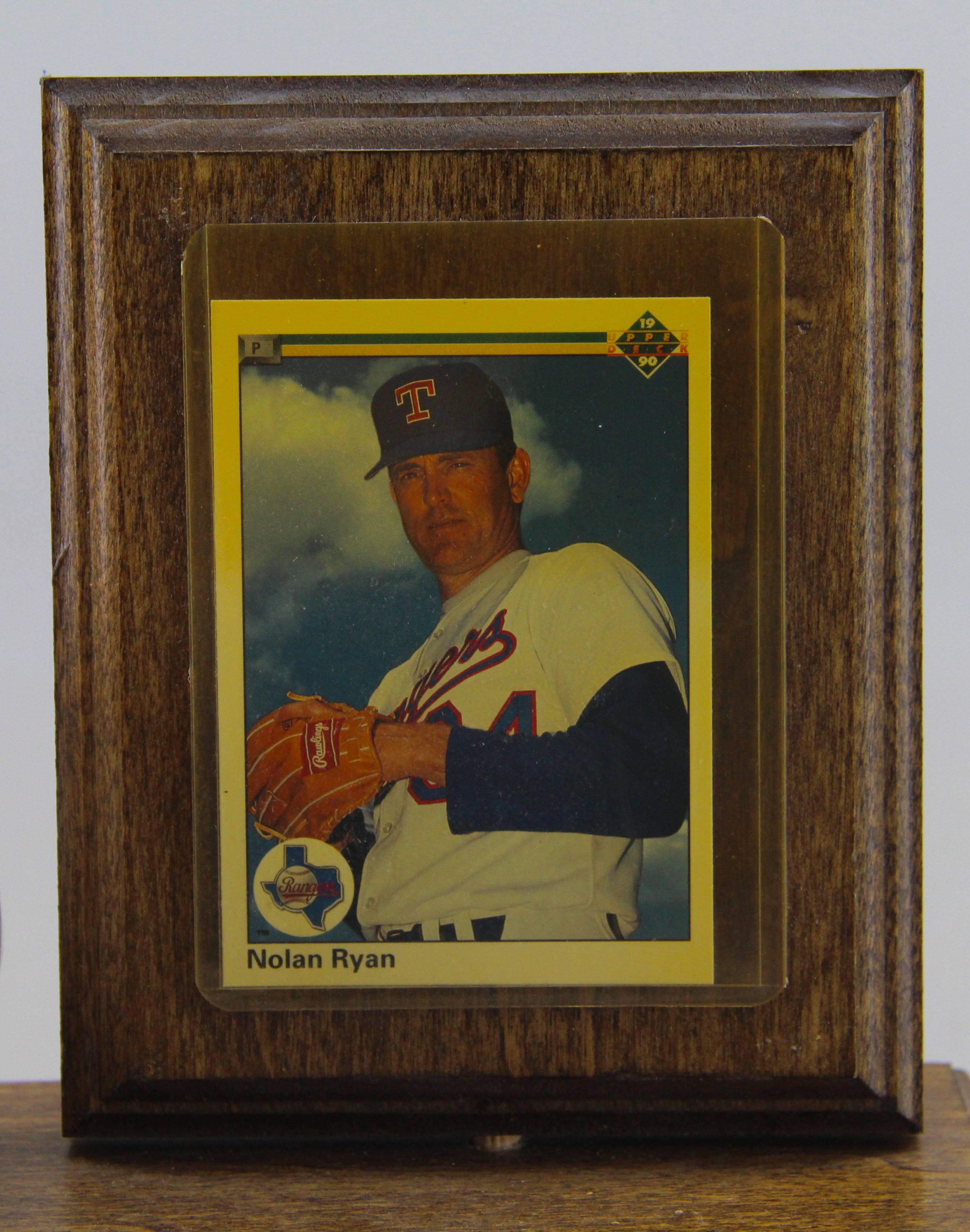 Autographed Nolan Ryan Baseball With Card On Wooden Stand