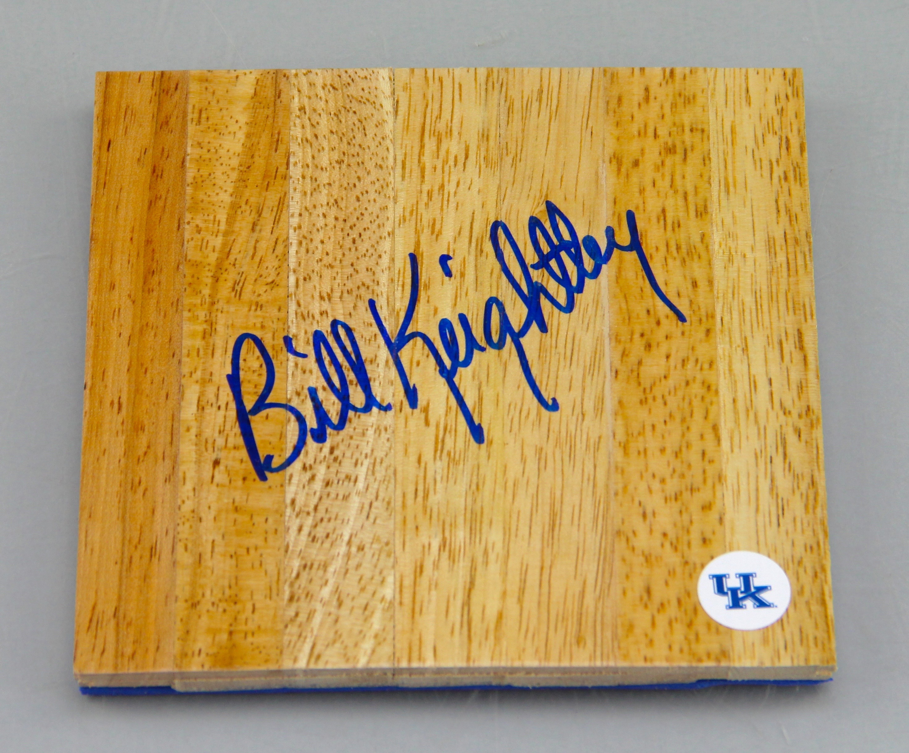 An Autographed Bill Keightley Wood Piece