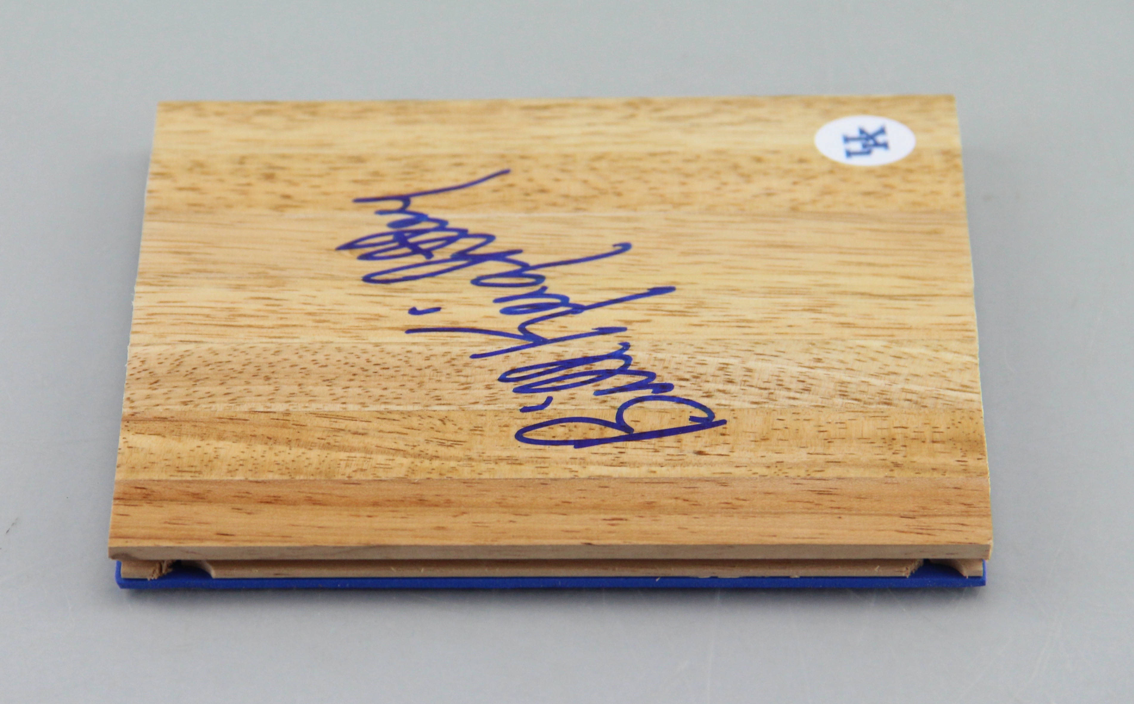 An Autographed Bill Keightley Wood Piece