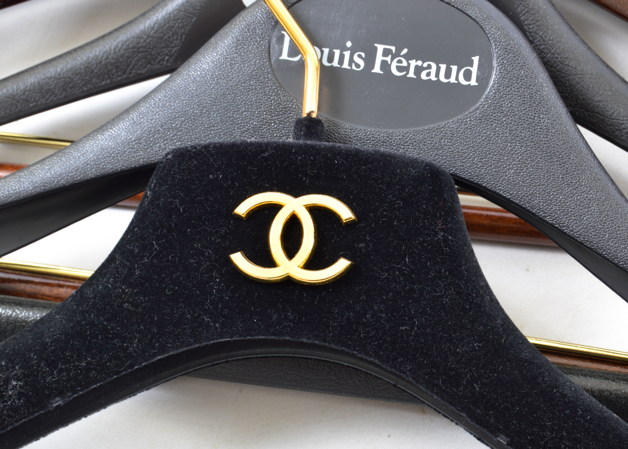 Assortment of Hangers Featuring Chanel and Ralph Lauren