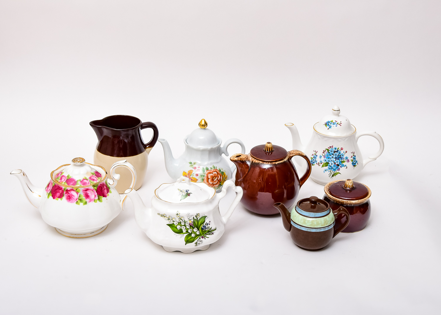 Collection of Teapots and Creamers