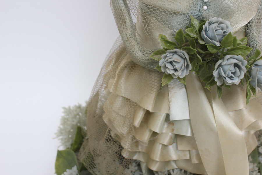 Vintage Doll Holding Blue Flower Bouquet