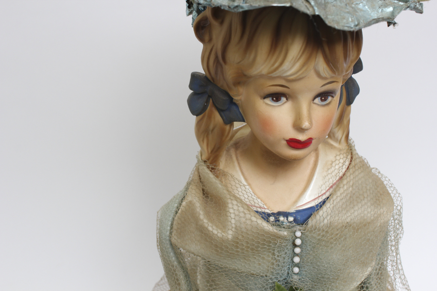 Vintage Doll Holding Blue Flower Bouquet