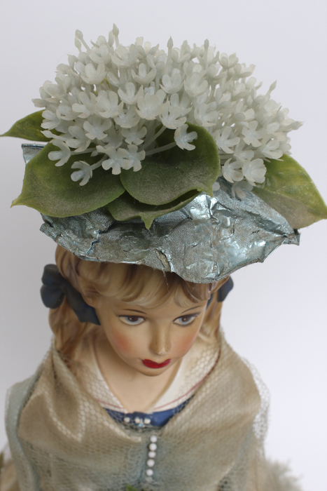 Vintage Doll Holding Blue Flower Bouquet